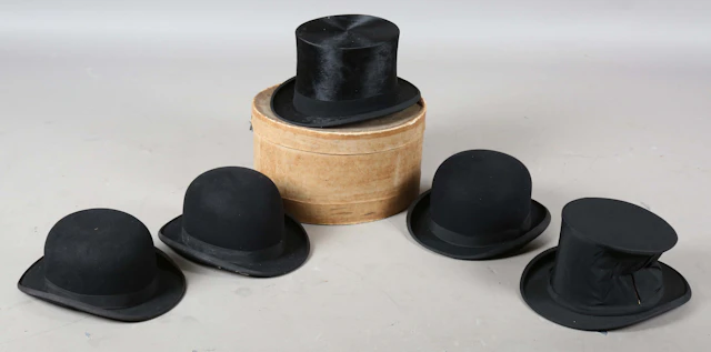 A black moleskin top hat by Dunn & Co, head circumference 60cm, together
