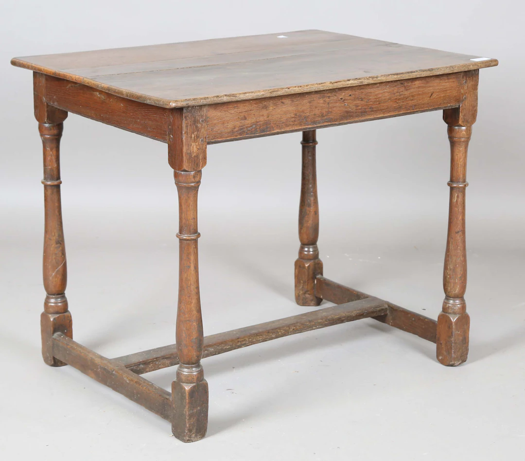 A 17th century oak rectangular table, on turned and block legs, height