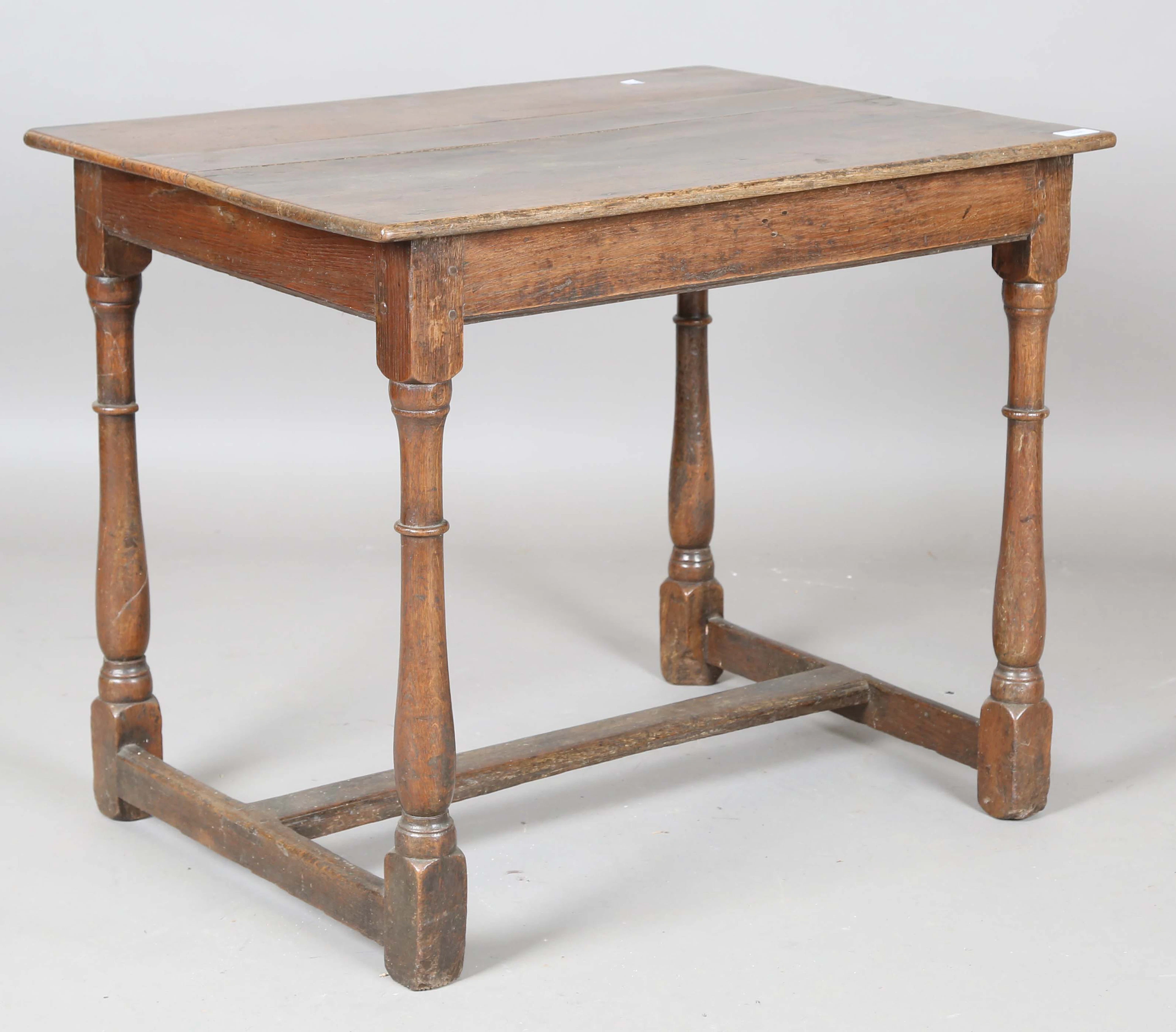 A 17th century oak rectangular table, on turned and block legs, height