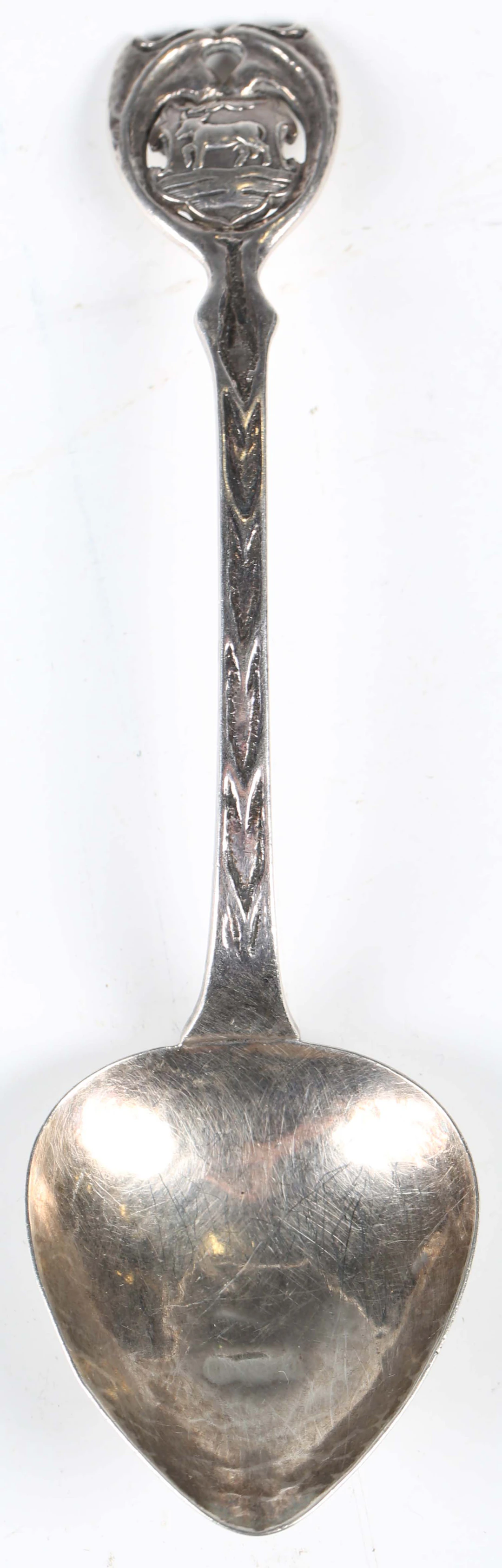 An Edwardian Arts and Crafts silver spoon by A.E. Jones, the cast