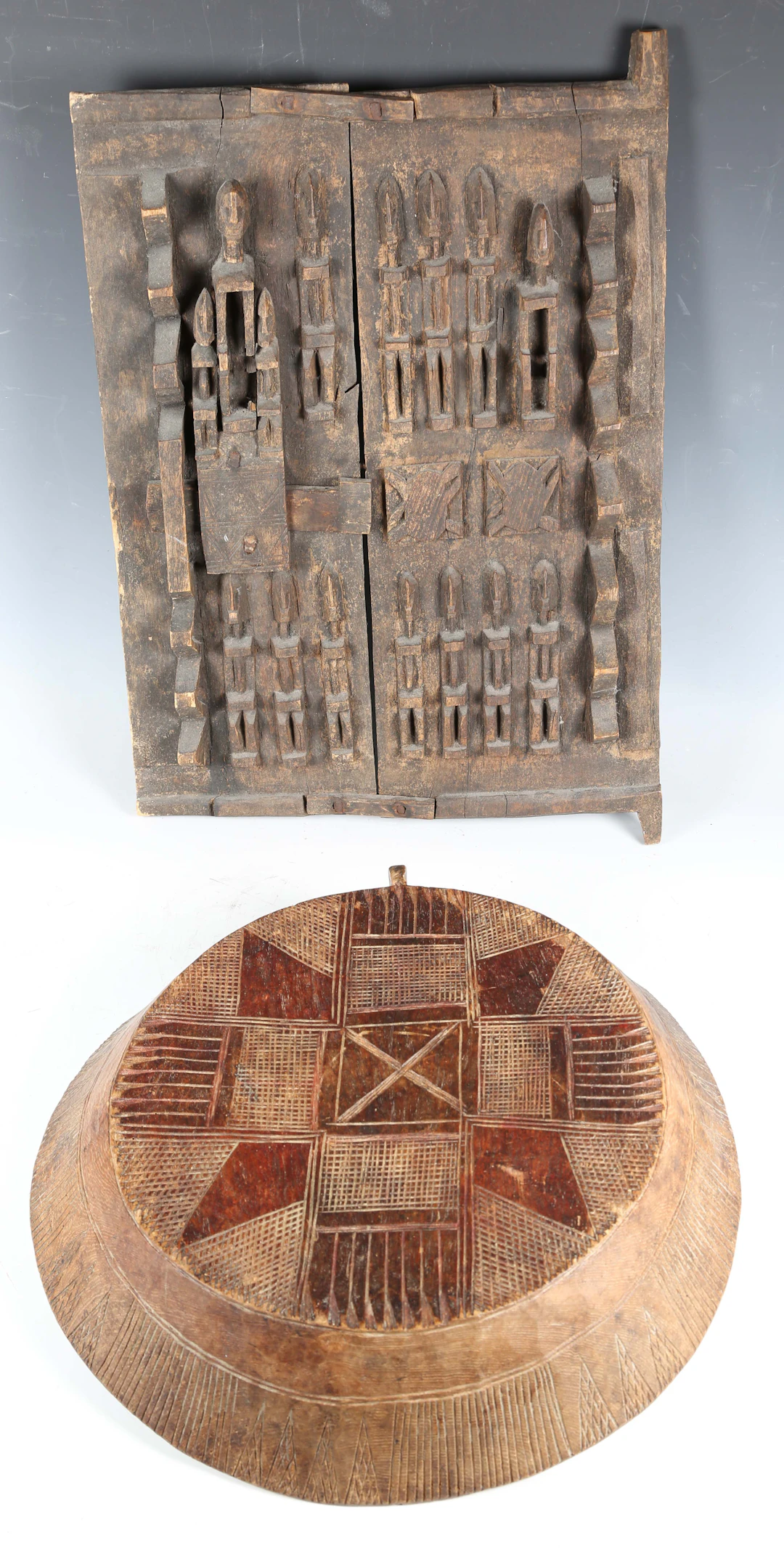 A Dogon carved wooden granary door, Mali, carved with overall ancestral
