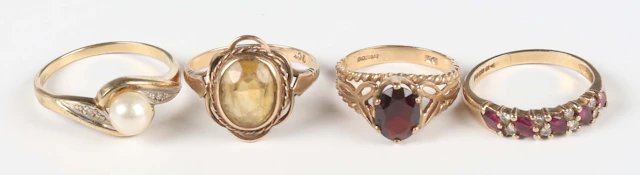 A 9ct gold, ruby and diamond ring, mounted with a row of marquise