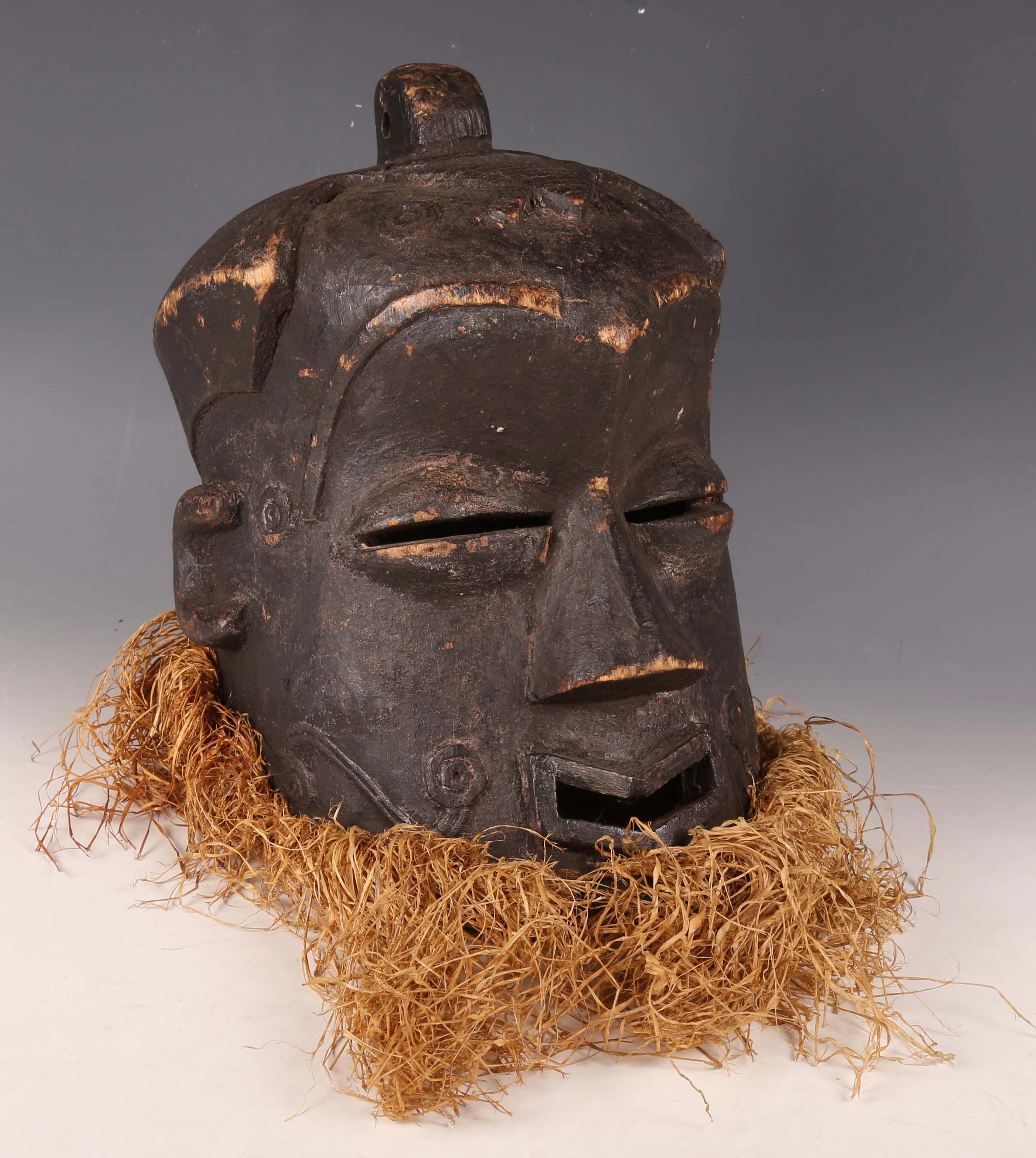 A Kuba carved wooden helmet mask, Democratic Republic of Congo, the