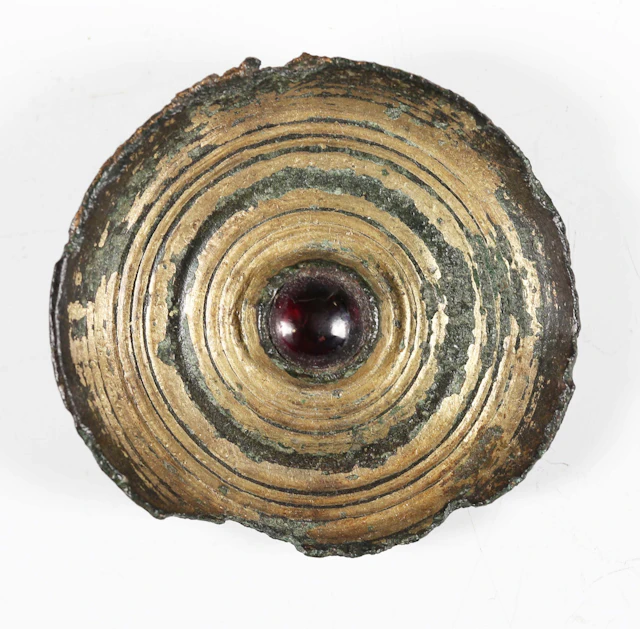 An Anglo-Saxon gilded copper alloy circular saucer brooch with inset