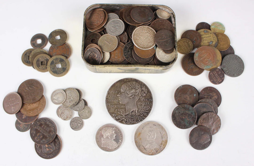 A collection of European and world coins, banknotes and paranumismatic