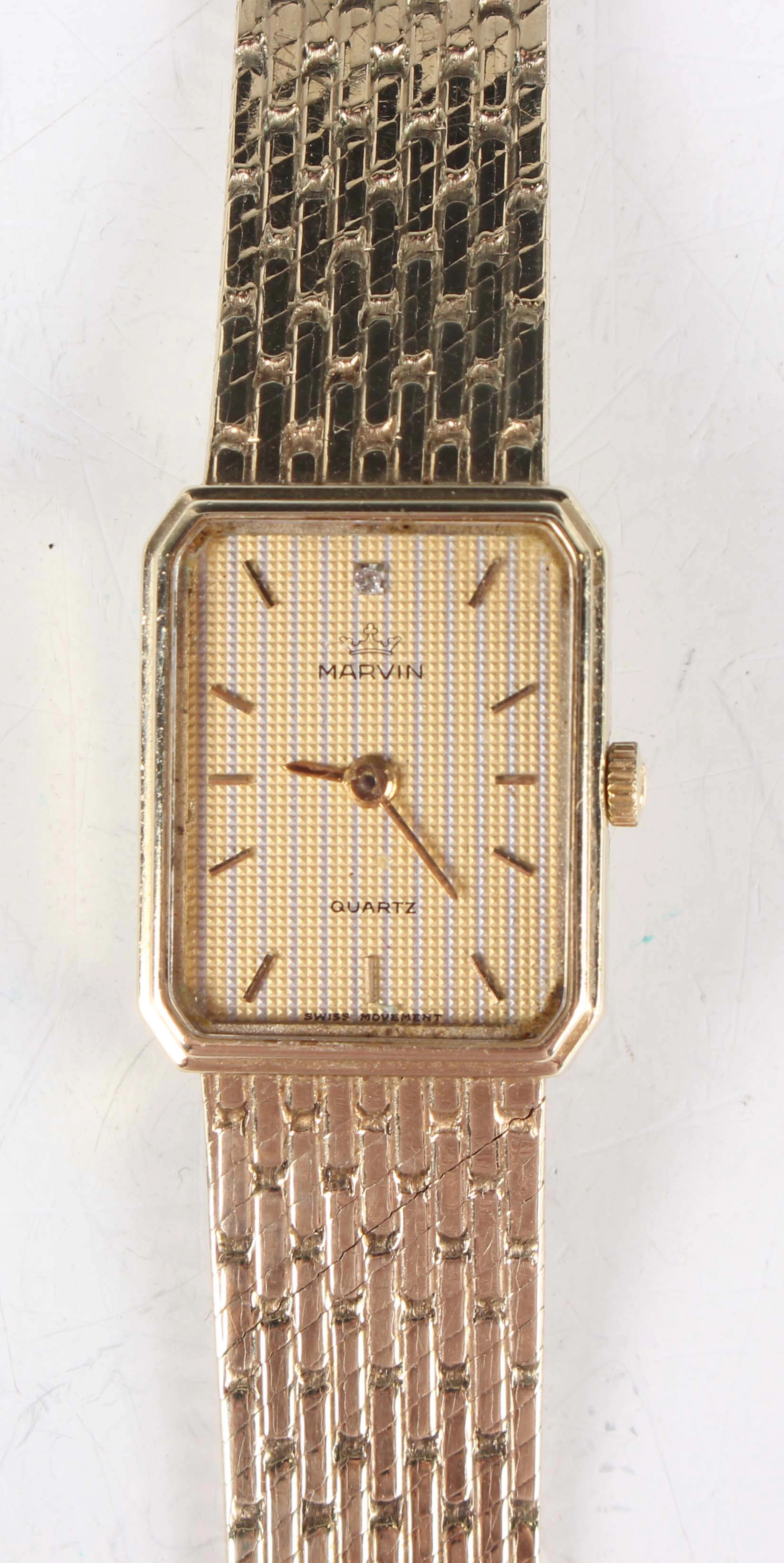 A Marvin 9ct gold lady's bracelet wristwatch with quartz movement