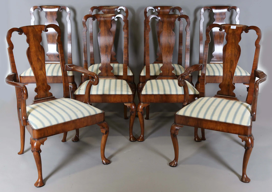 A set of eight mid-20th century Queen Anne style walnut dining chairs