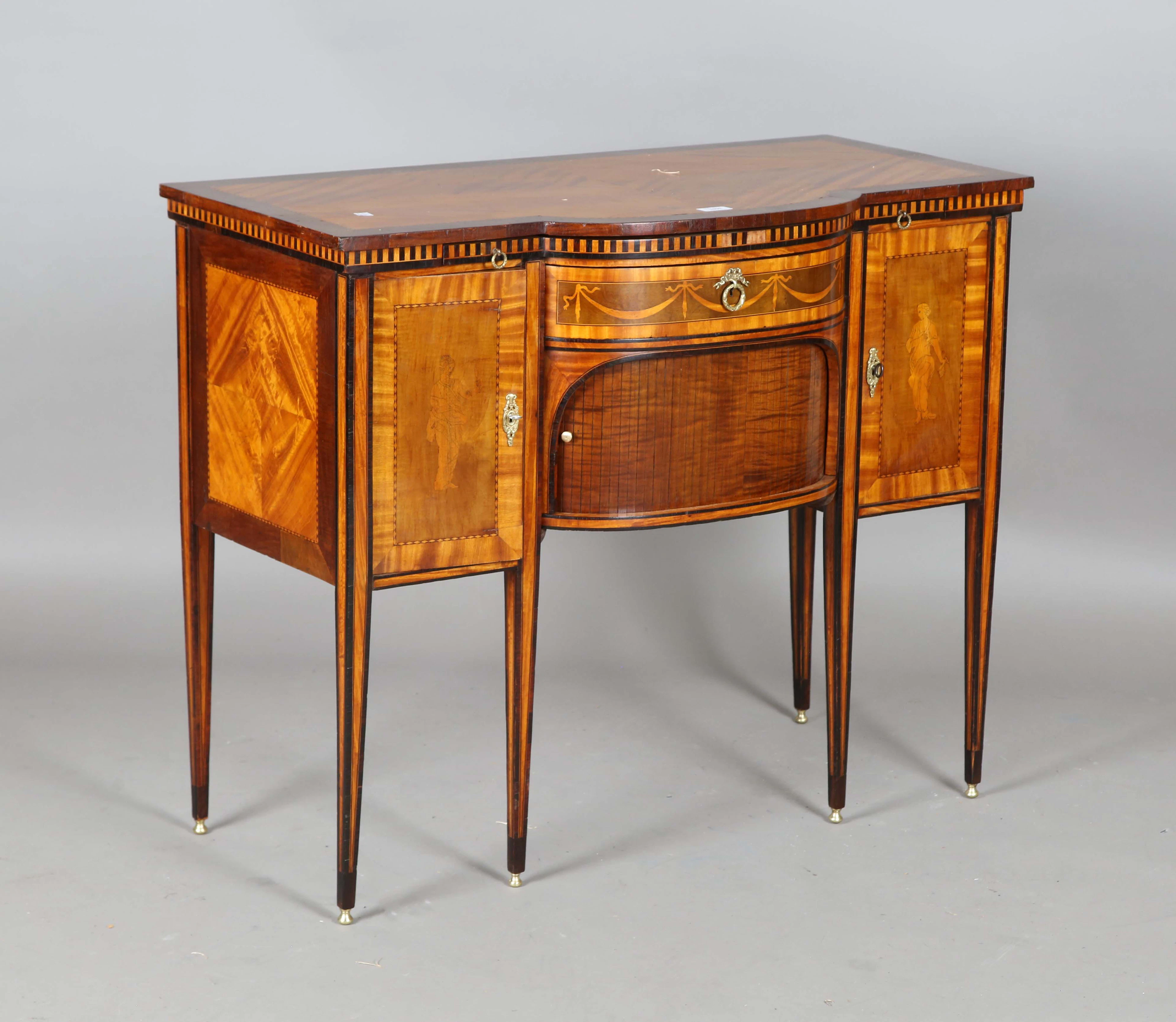 A late 19th century Neoclassical Revival satinwood and mahogany bowfront