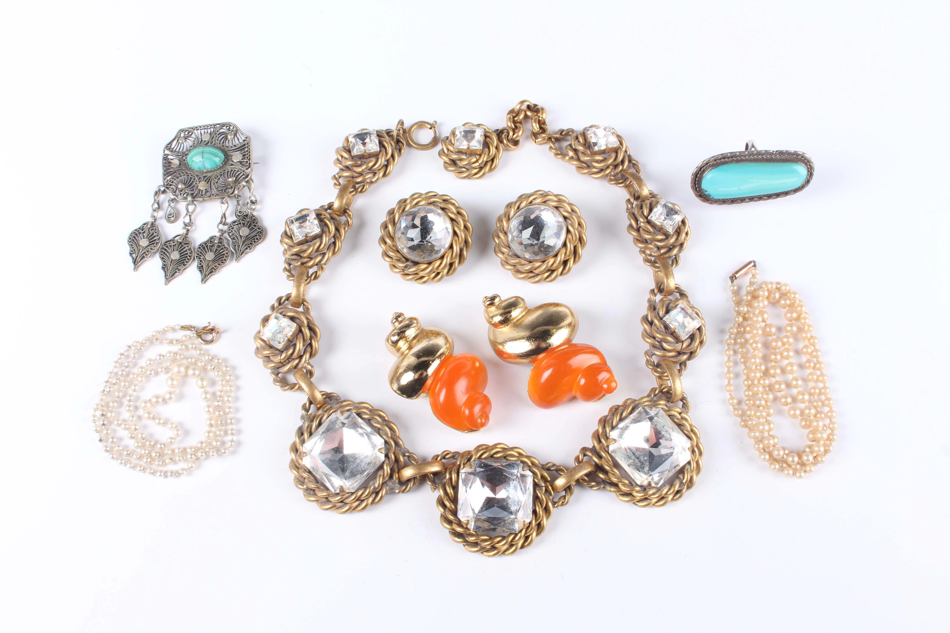 A pair of Christian Dior tangerine lucite and gilt metal earclips