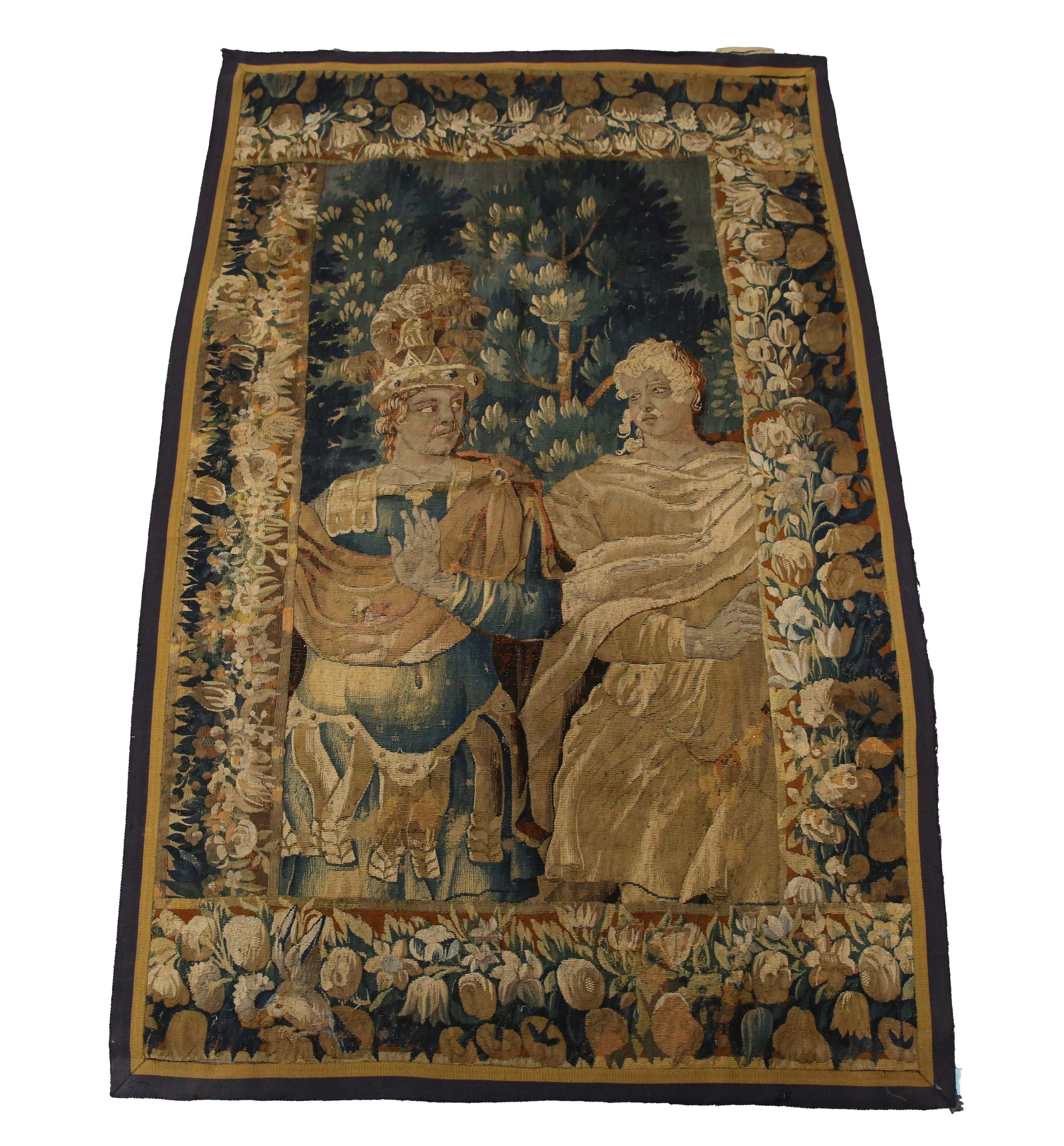 A 17th century Flemish tapestry wall hanging, worked with two three-quarter-leng
