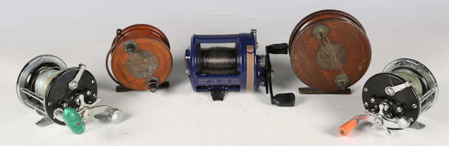 A quantity of sea fishing reels, rods and accessories, including a