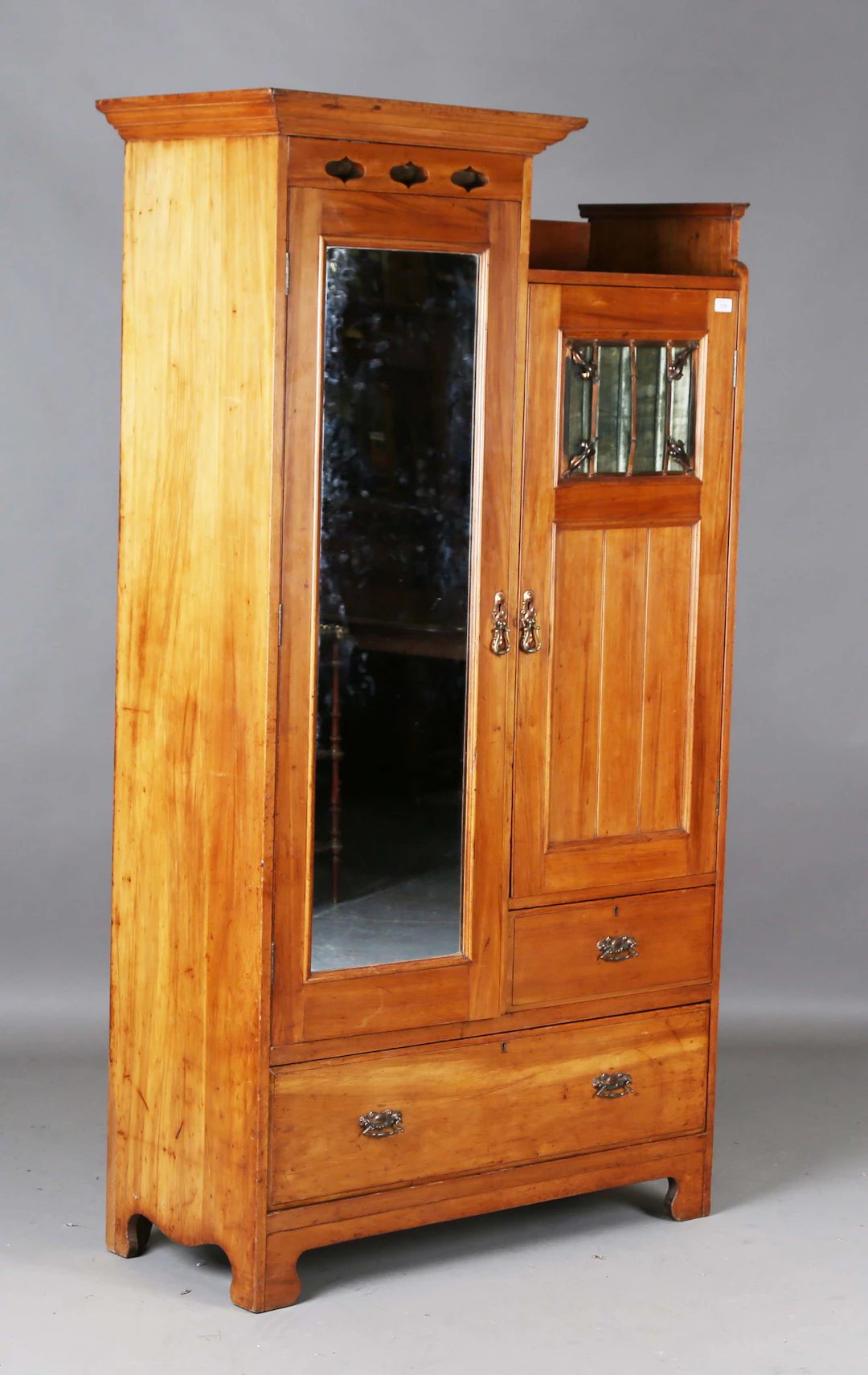 An Edwardian Arts and Crafts satin walnut wardrobe, the right hand
