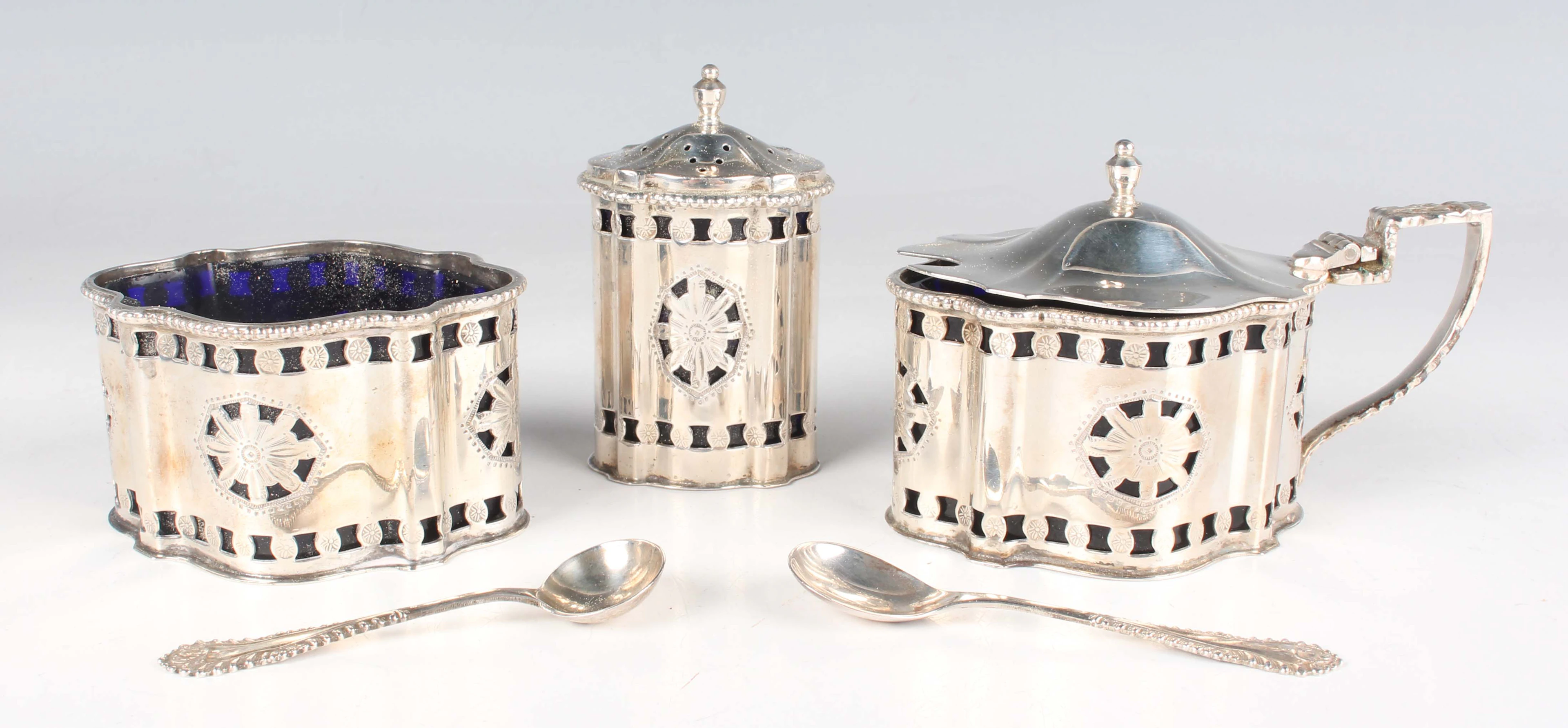 An Elizabeth II silver three-piece condiment set of shaped oval form