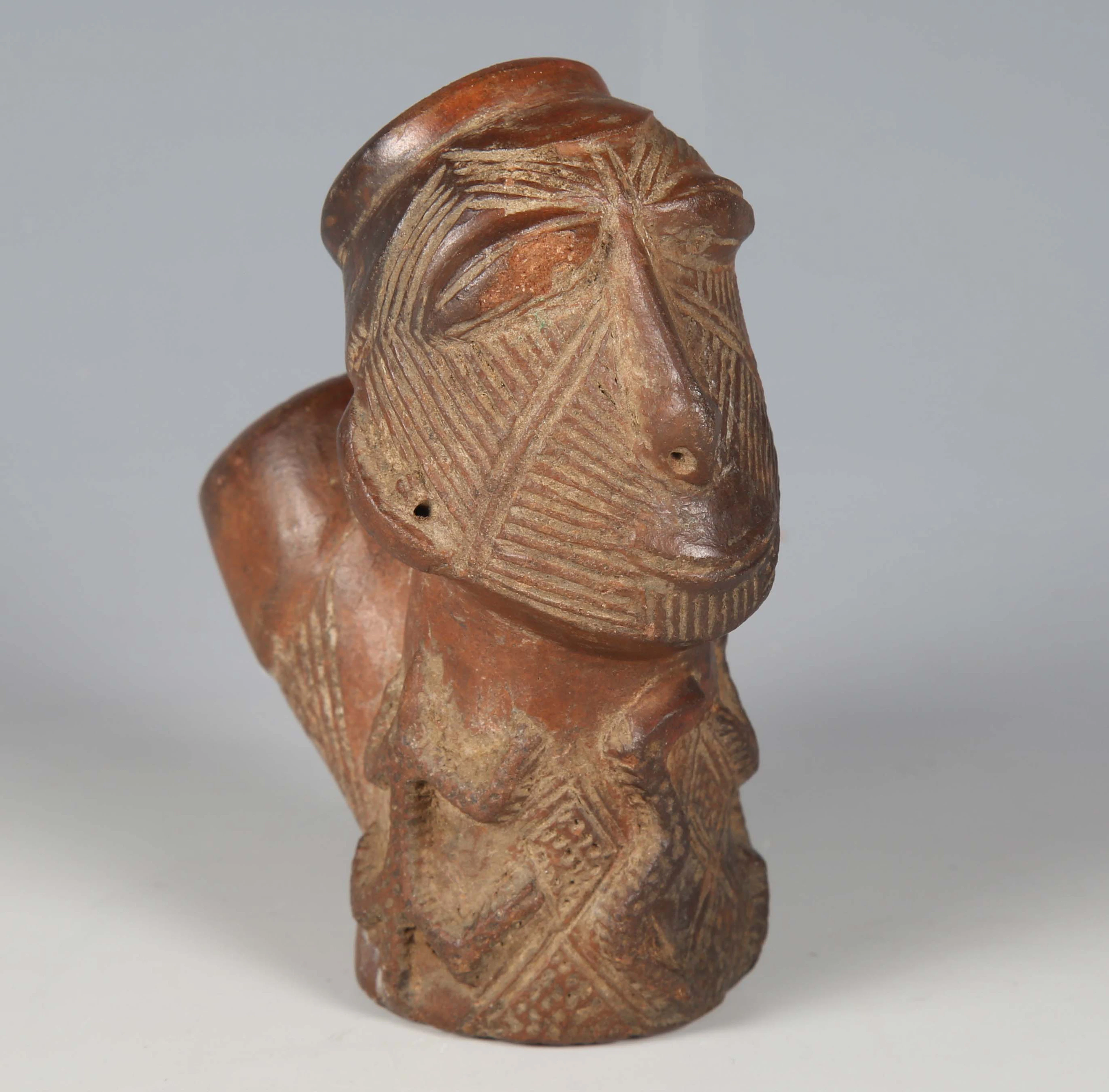 A Frafra terracotta pipe bowl, Ghana, modelled as a man's head with