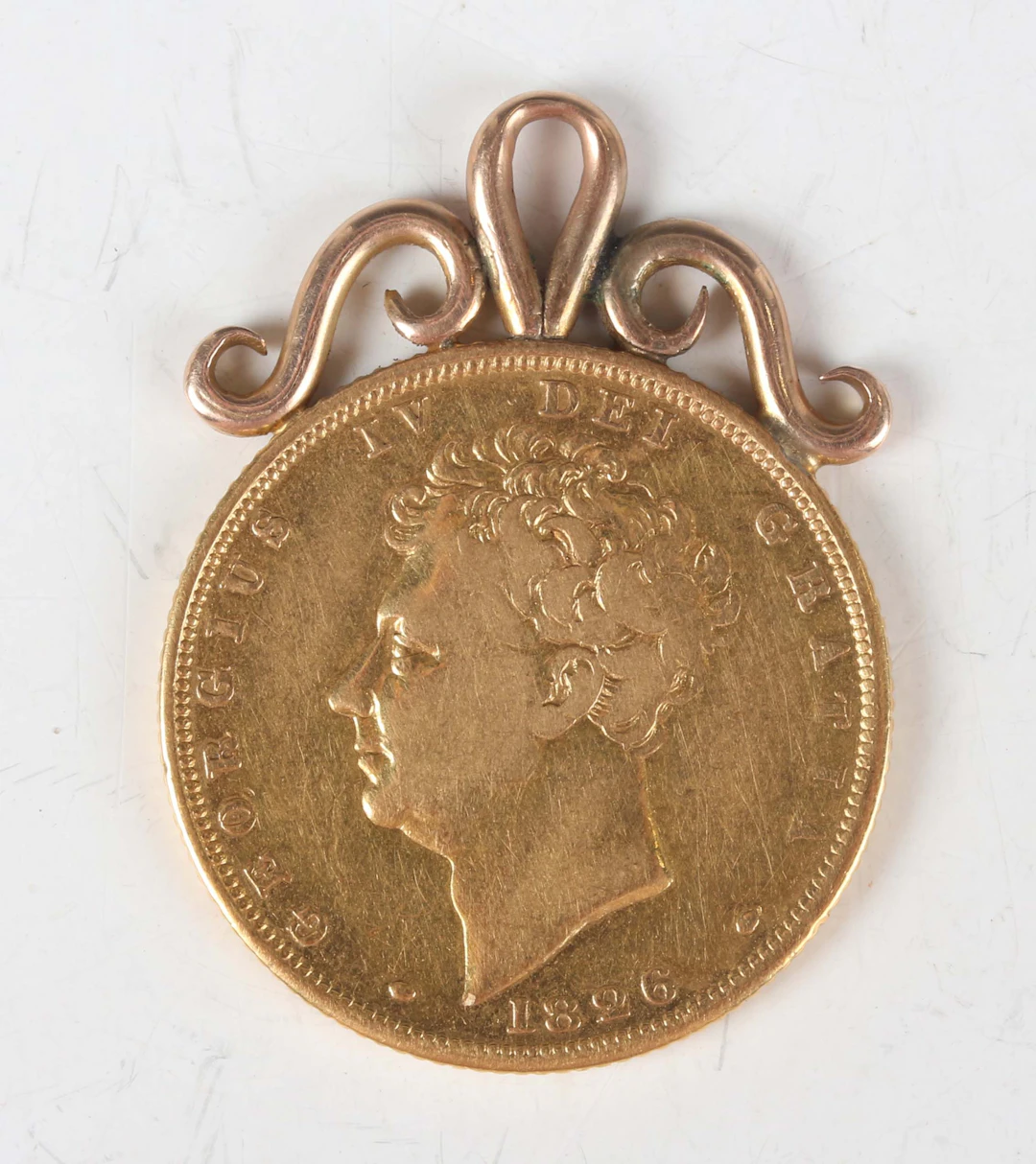 A George IV sovereign 1826 with scroll pendant mount.