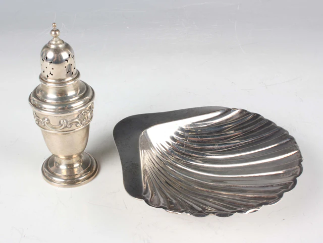 A George V silver butter shell, raised on ball feet, Sheffield 1917