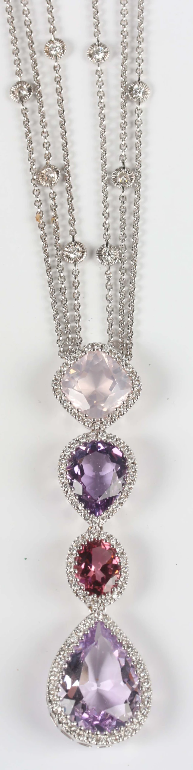 An 18ct white gold, amethyst, rose quartz, pink tourmaline and diamond