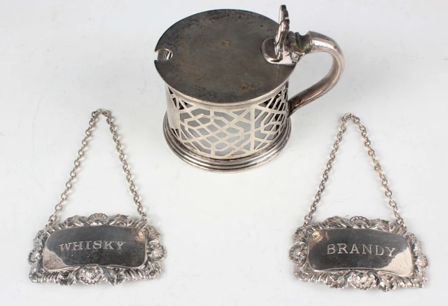 A pair of Elizabeth II silver decanter labels, comprising 'Whisky'
