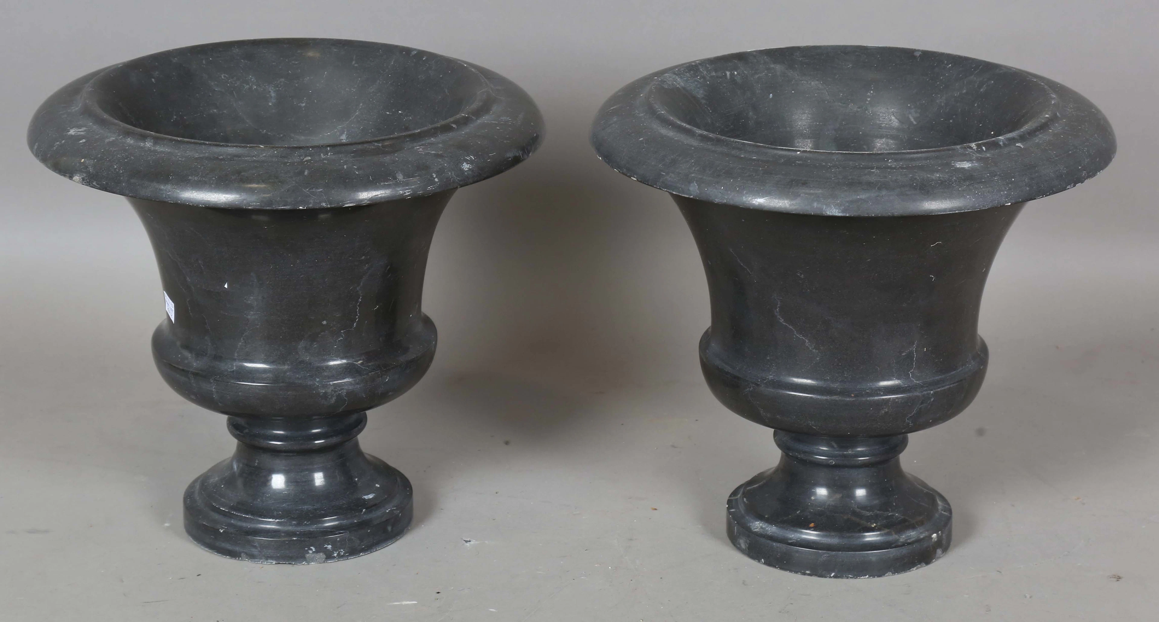A pair of 20th century turned and polished slate garden urns, height