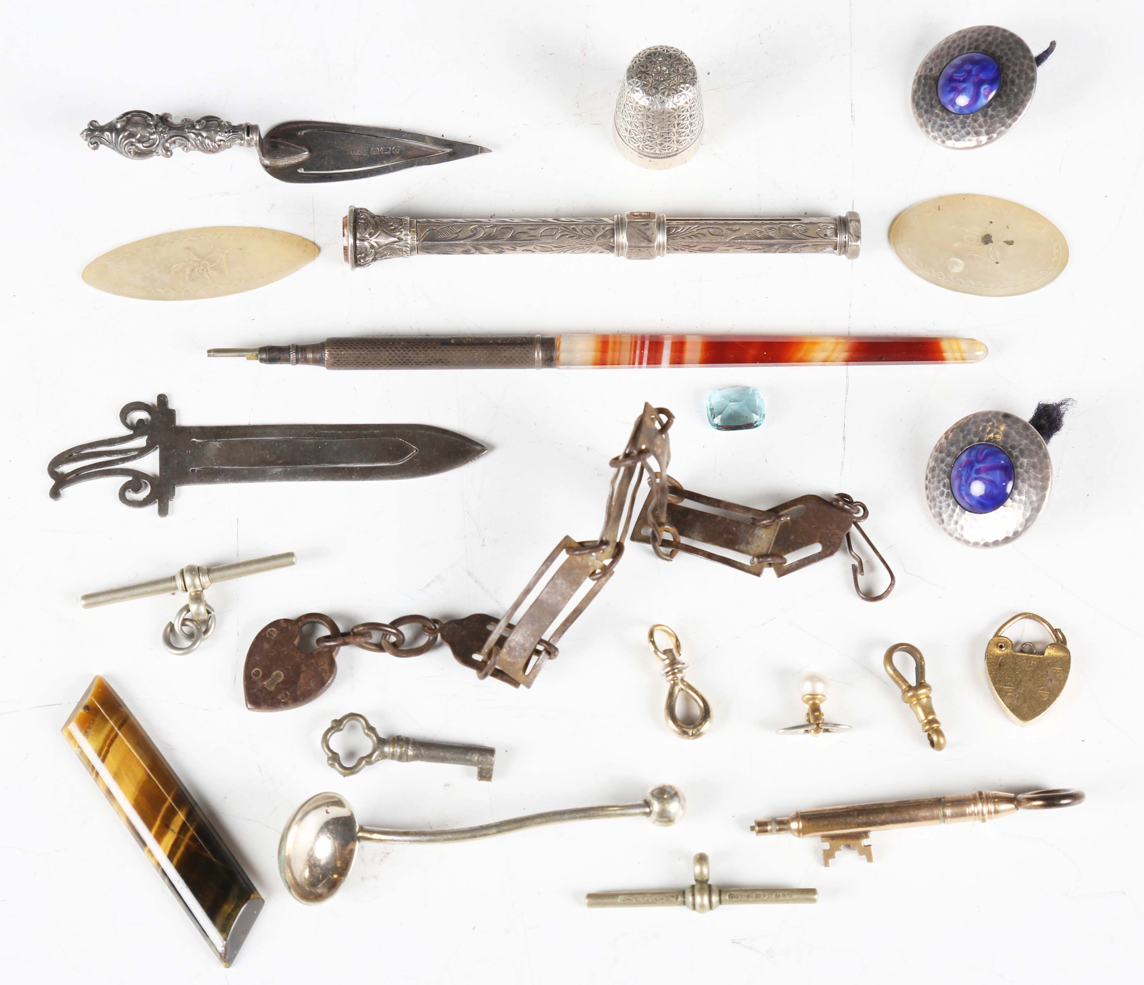 A small group of collectors' items, including a propelling pencil