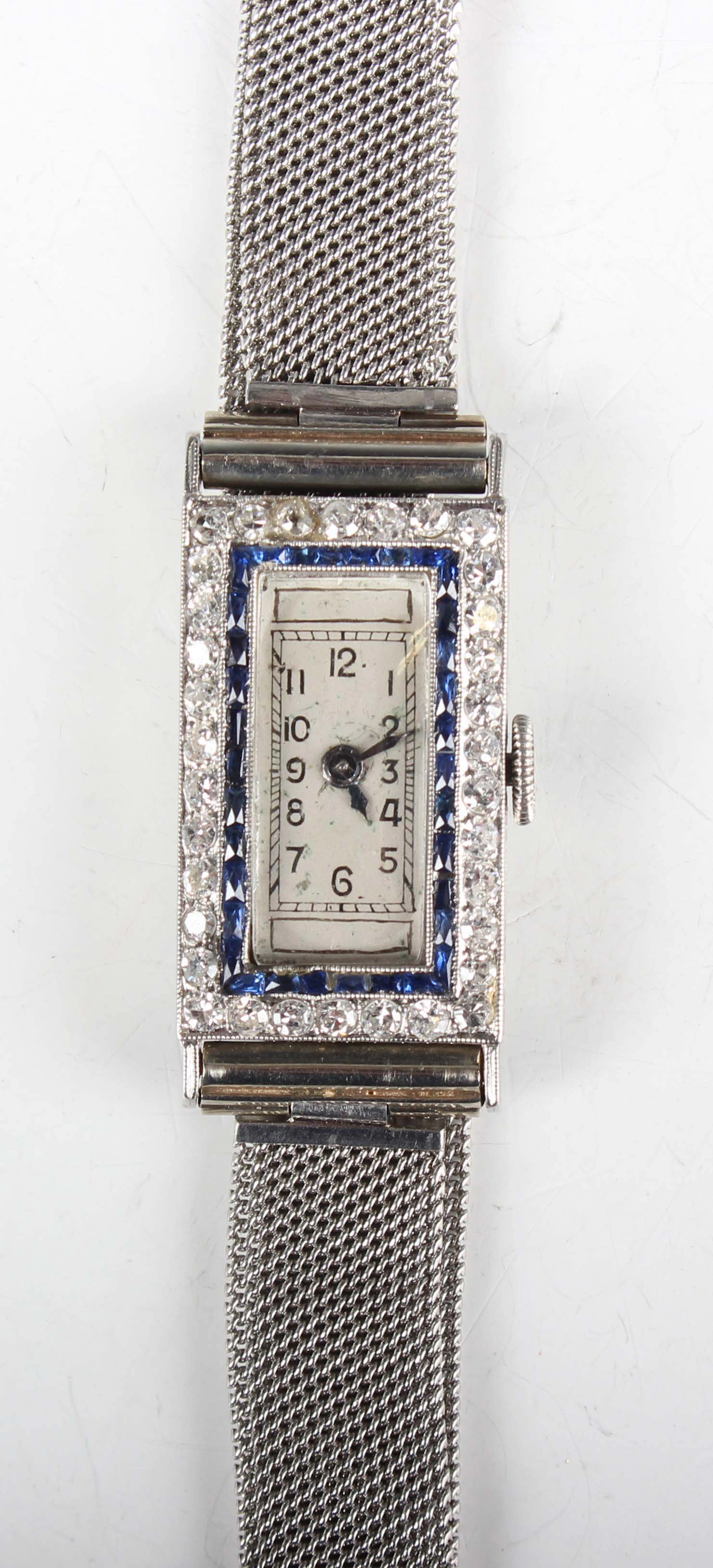 An Art Deco sapphire and diamond set platinum rectangular cased lady's