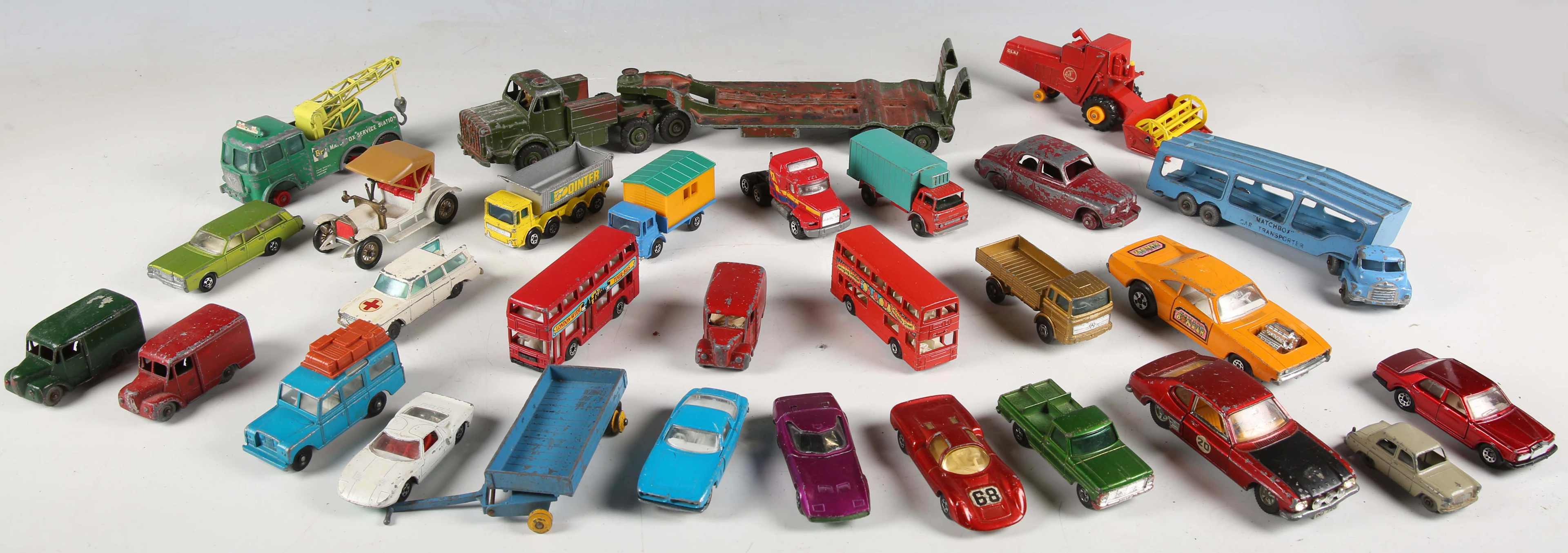 A collection of diecast vehicles, including Corgi Toys Major car transporter