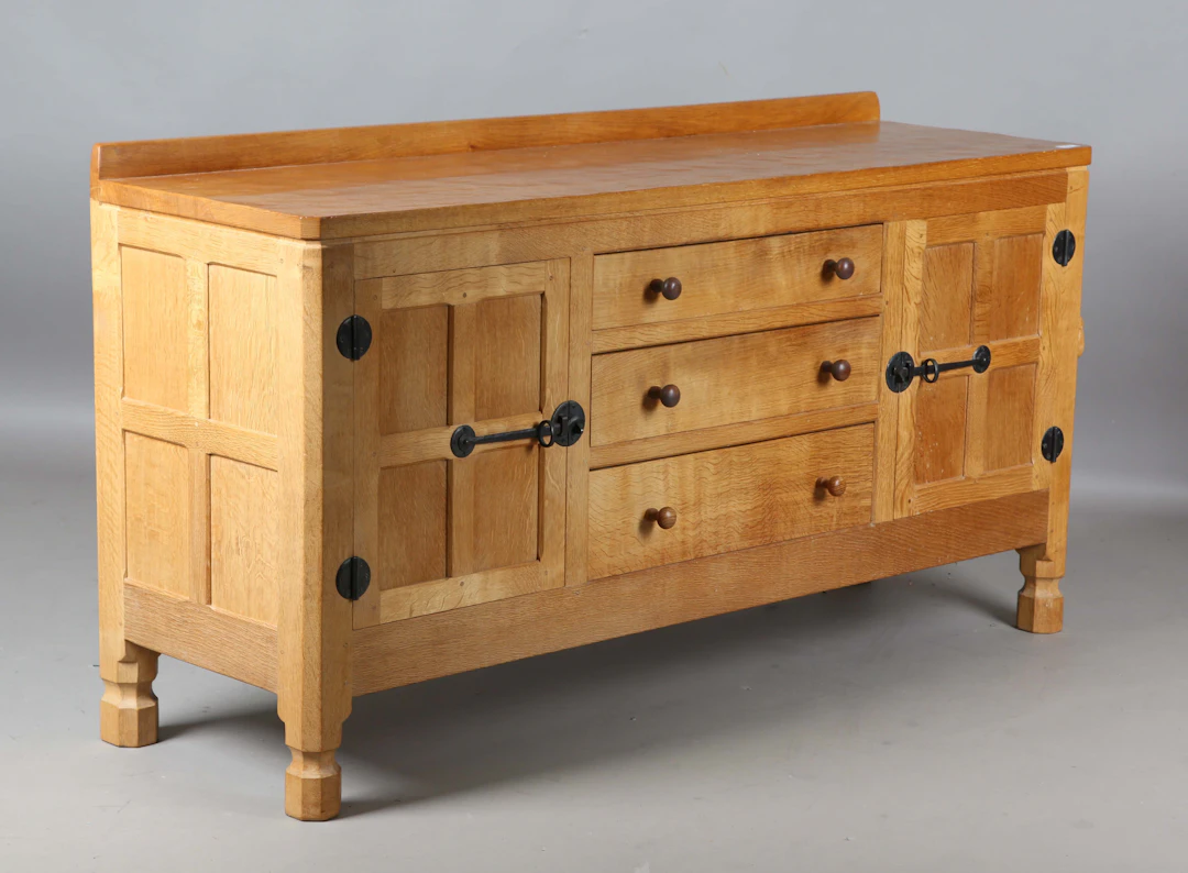 A Robert 'Mouseman' Thompson oak sideboard, fitted with three central
