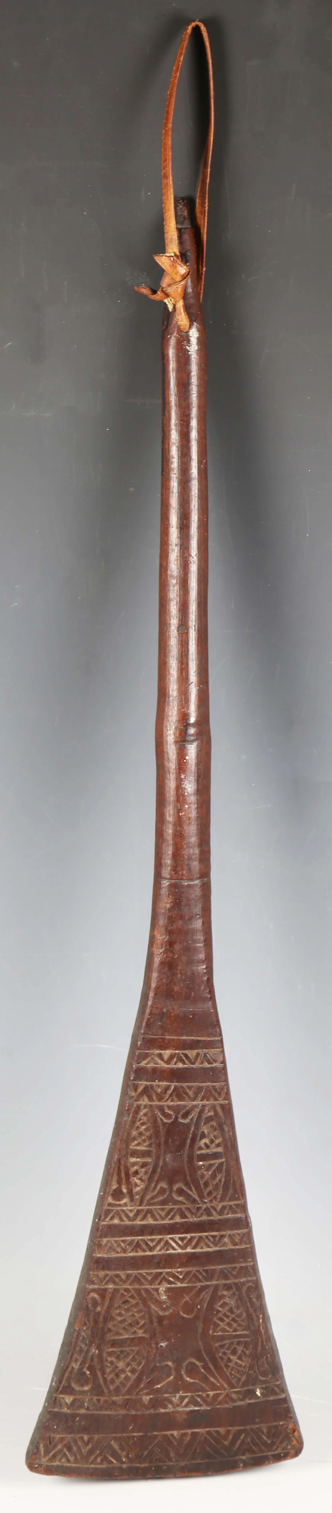 A Fijian carved hardwood paddle club, the flared blade with later