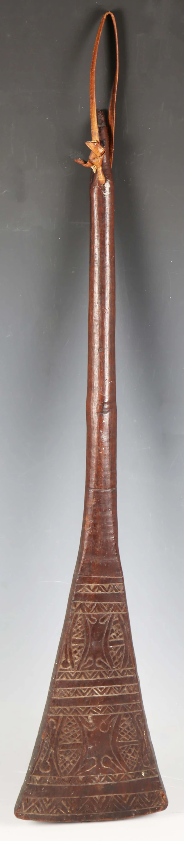 A Fijian carved hardwood paddle club, the flared blade with later