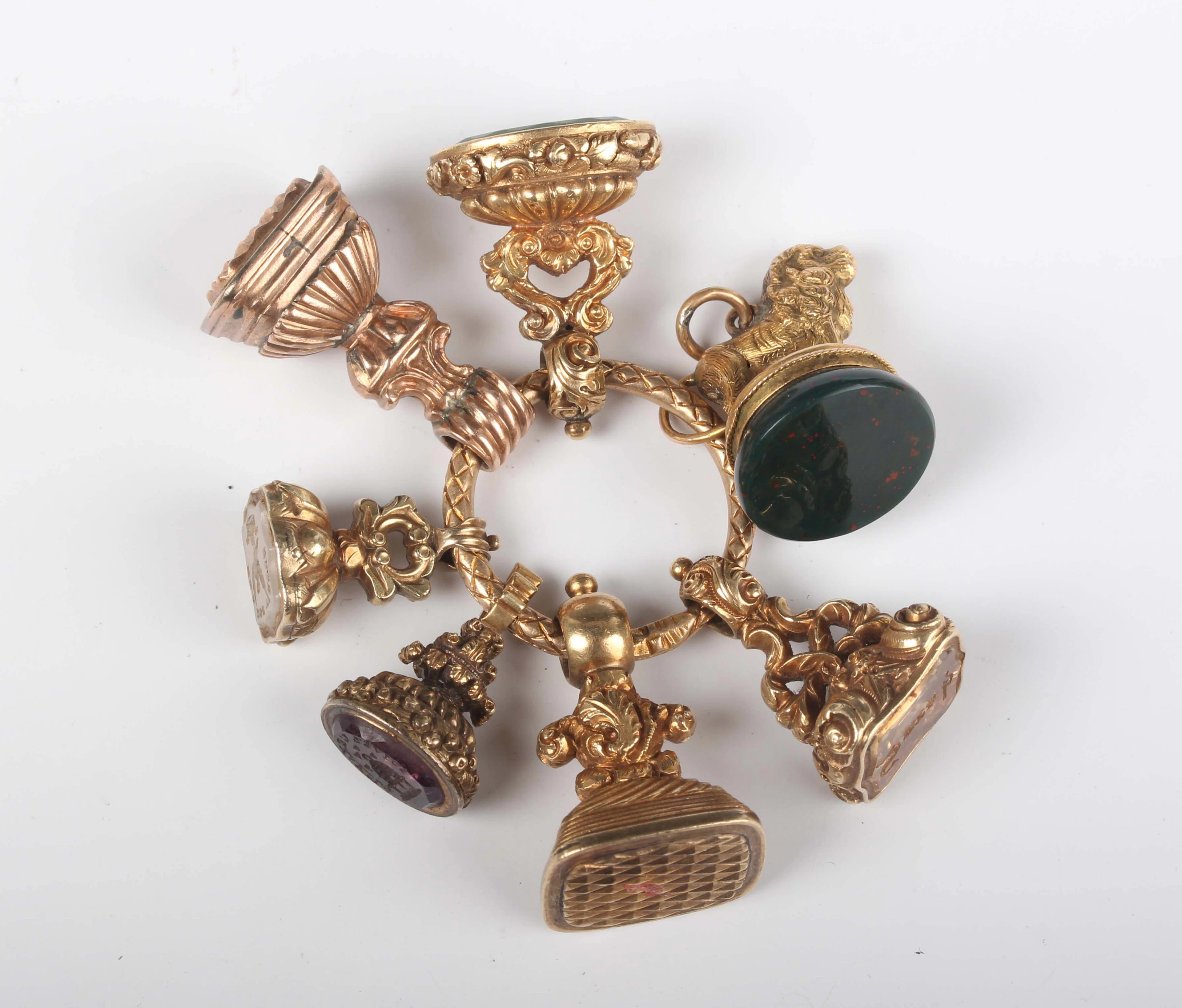 A group of seven Victorian gold cased and later pendant fob seals