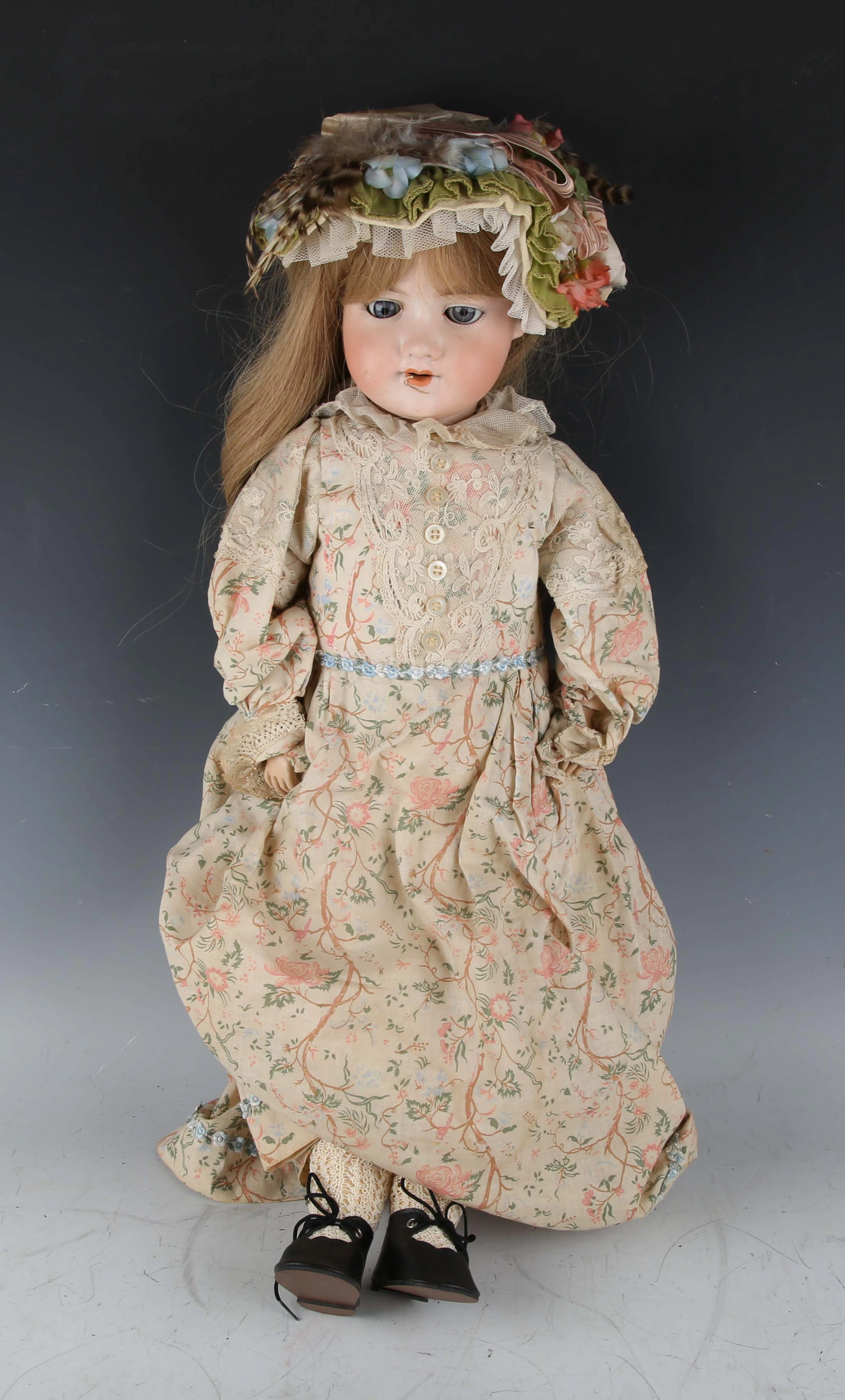 An Armand Marseille bisque head doll, impressed '390 DRGM 24.6 A7M'