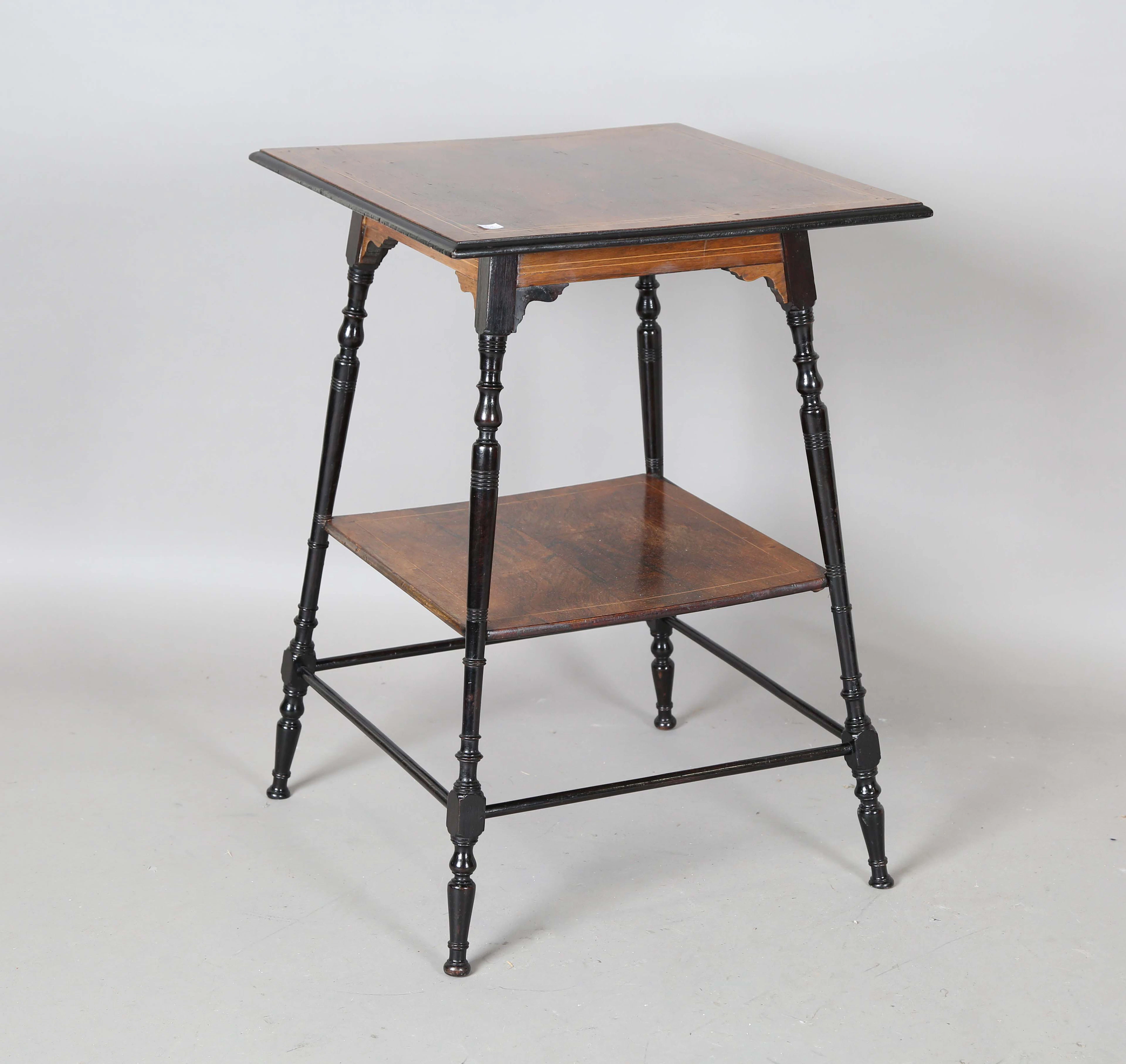 A late Victorian Aesthetic Movement rosewood and ebonized two-tier