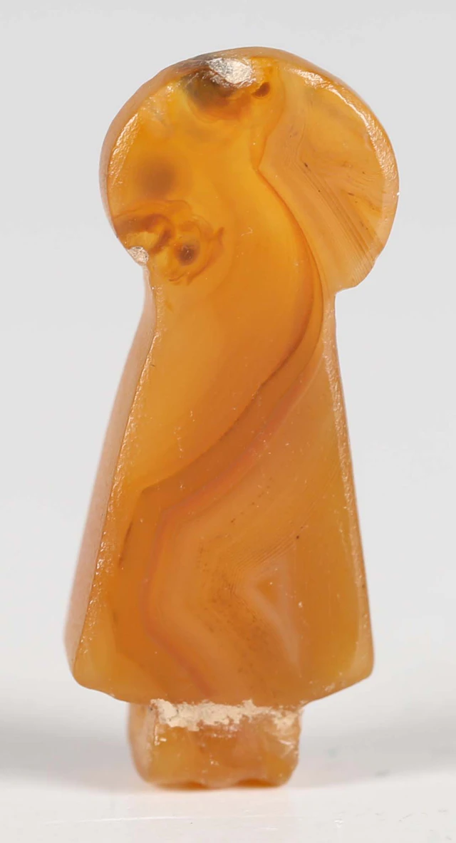 An ancient Egyptian carnelian menat pendant of inverted keyhole form