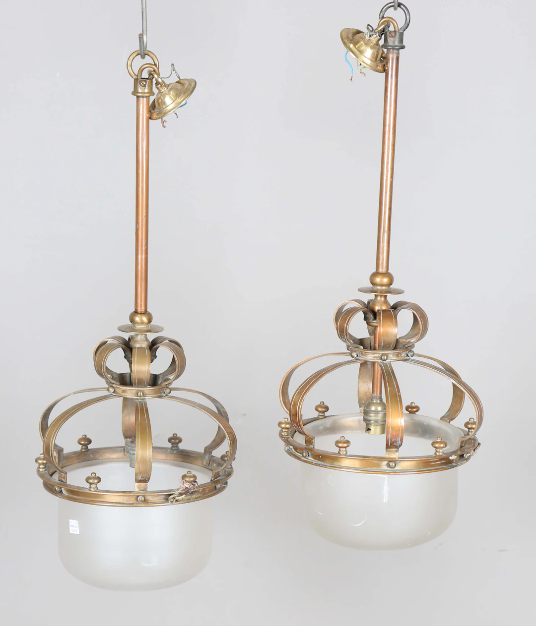 A pair of late 19th century brass framed pendant ceiling lights with