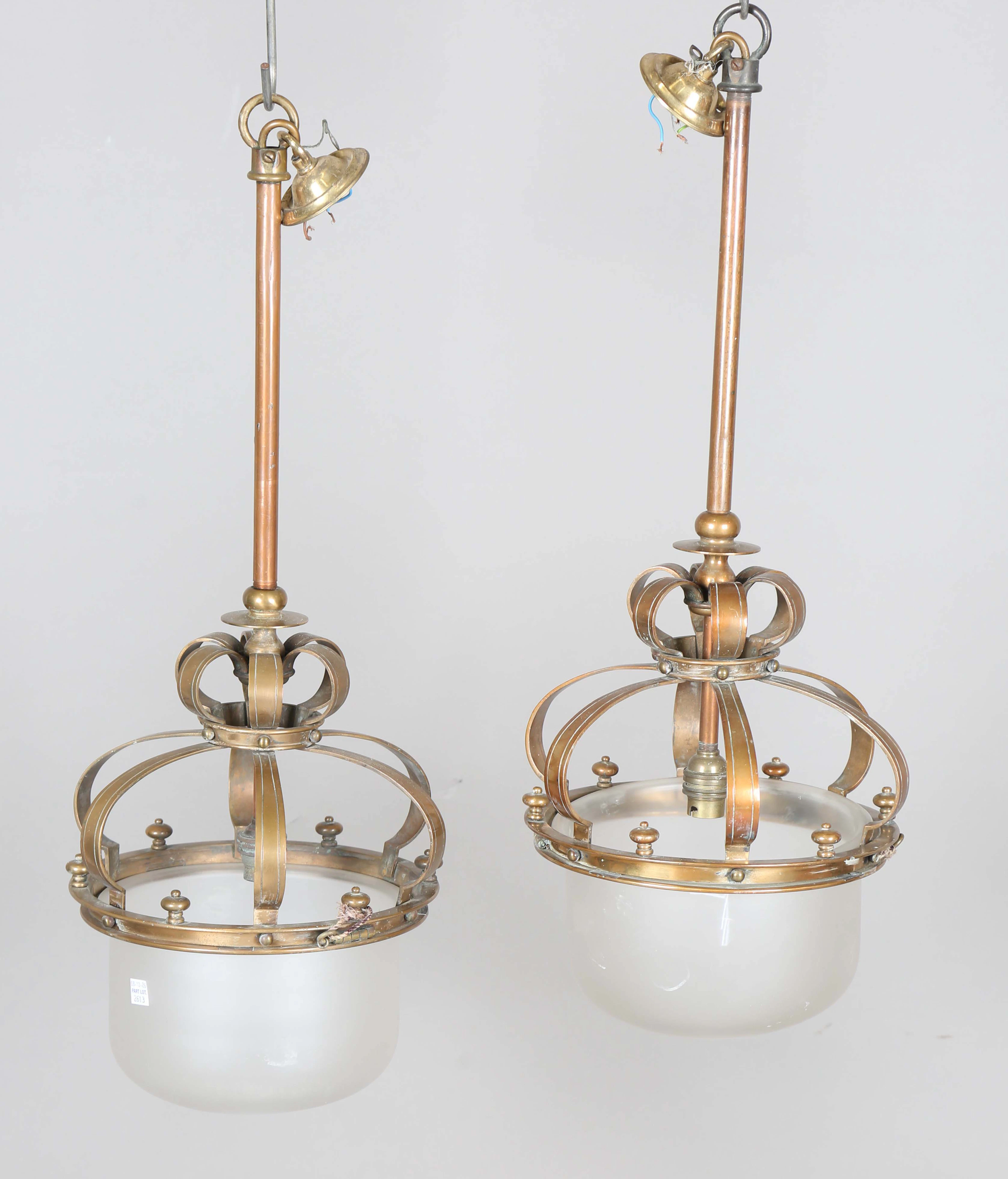 A pair of late 19th century brass framed pendant ceiling lights with
