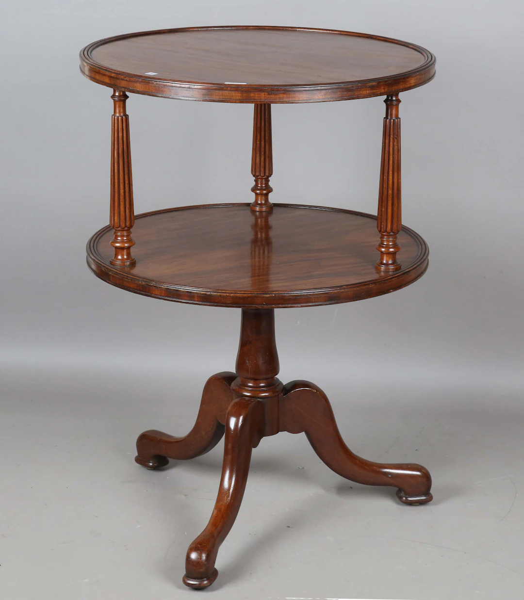 A mid-19th century French mahogany circular two-tier revolving dumb