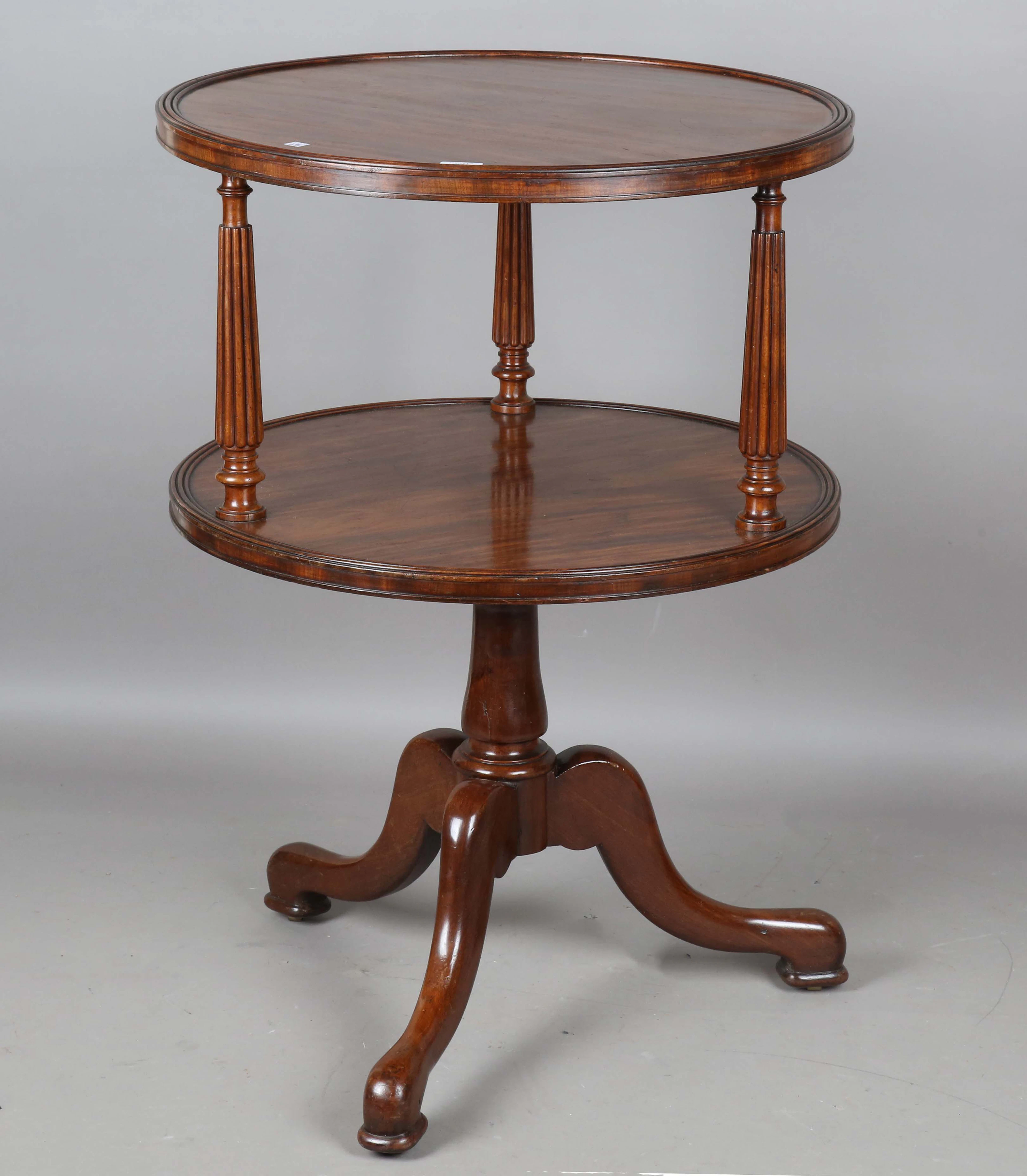 A mid-19th century French mahogany circular two-tier revolving dumb