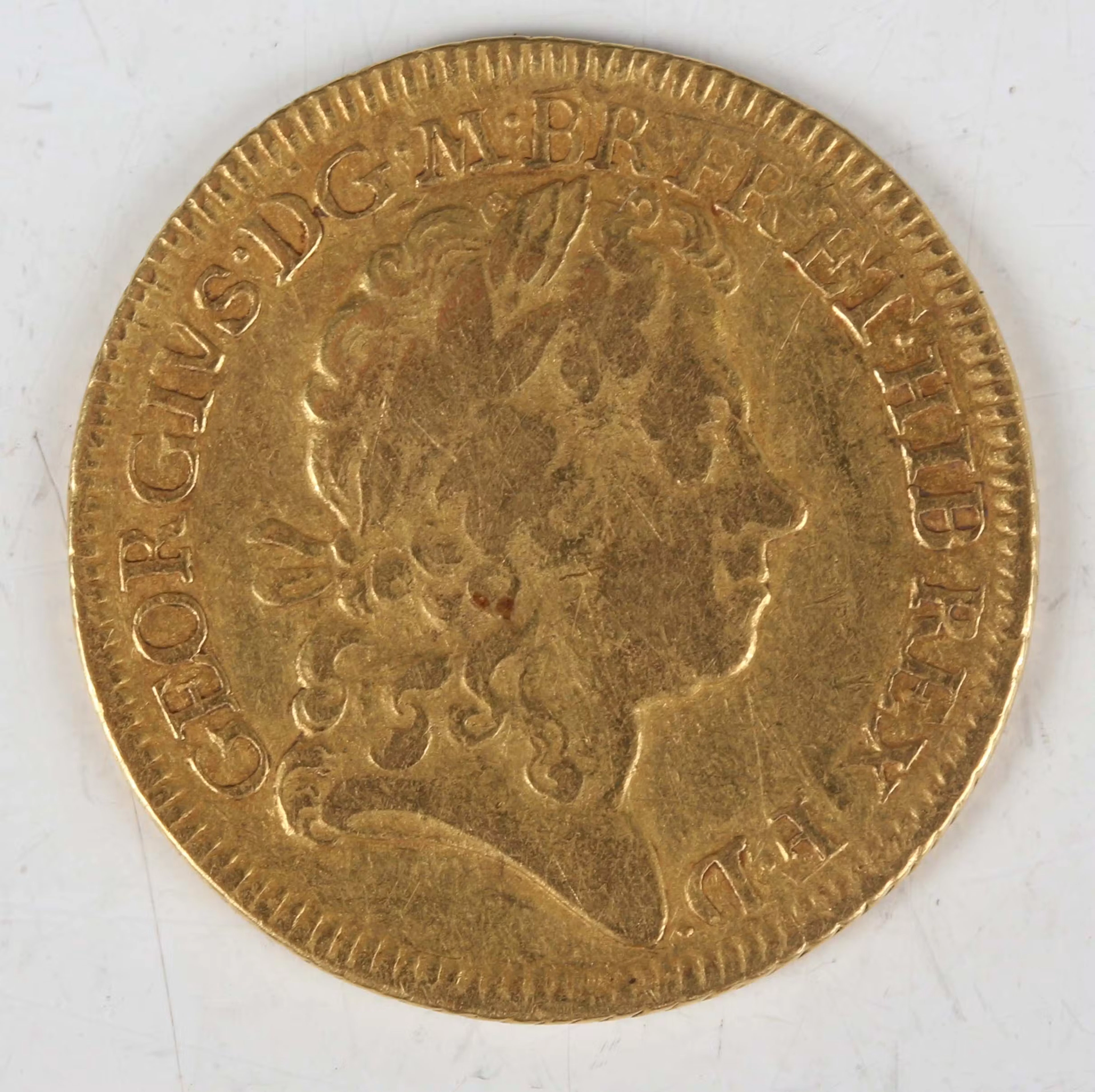 A scarce George I guinea 1716, fourth bust, tie with loop to hair