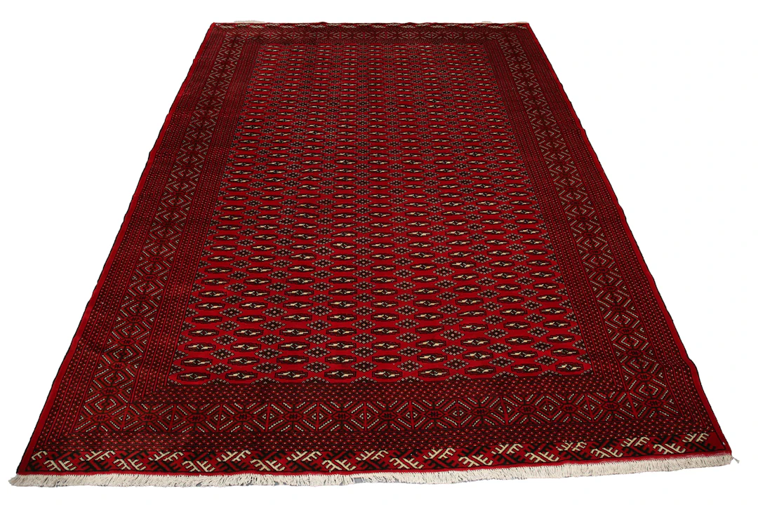A Turkestan carpet, late 20th century, the red field with overall