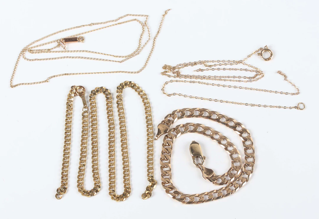 A gold faceted curblink bracelet on a sprung hook shaped clasp, a