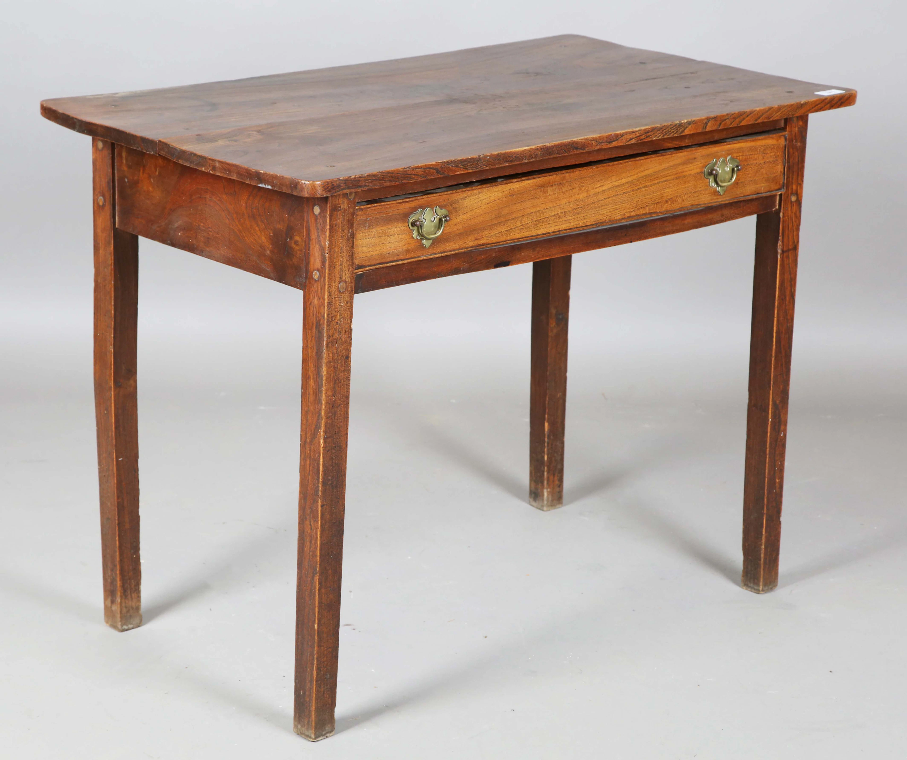 An 18th century provincial elm side table, fitted with a single frieze