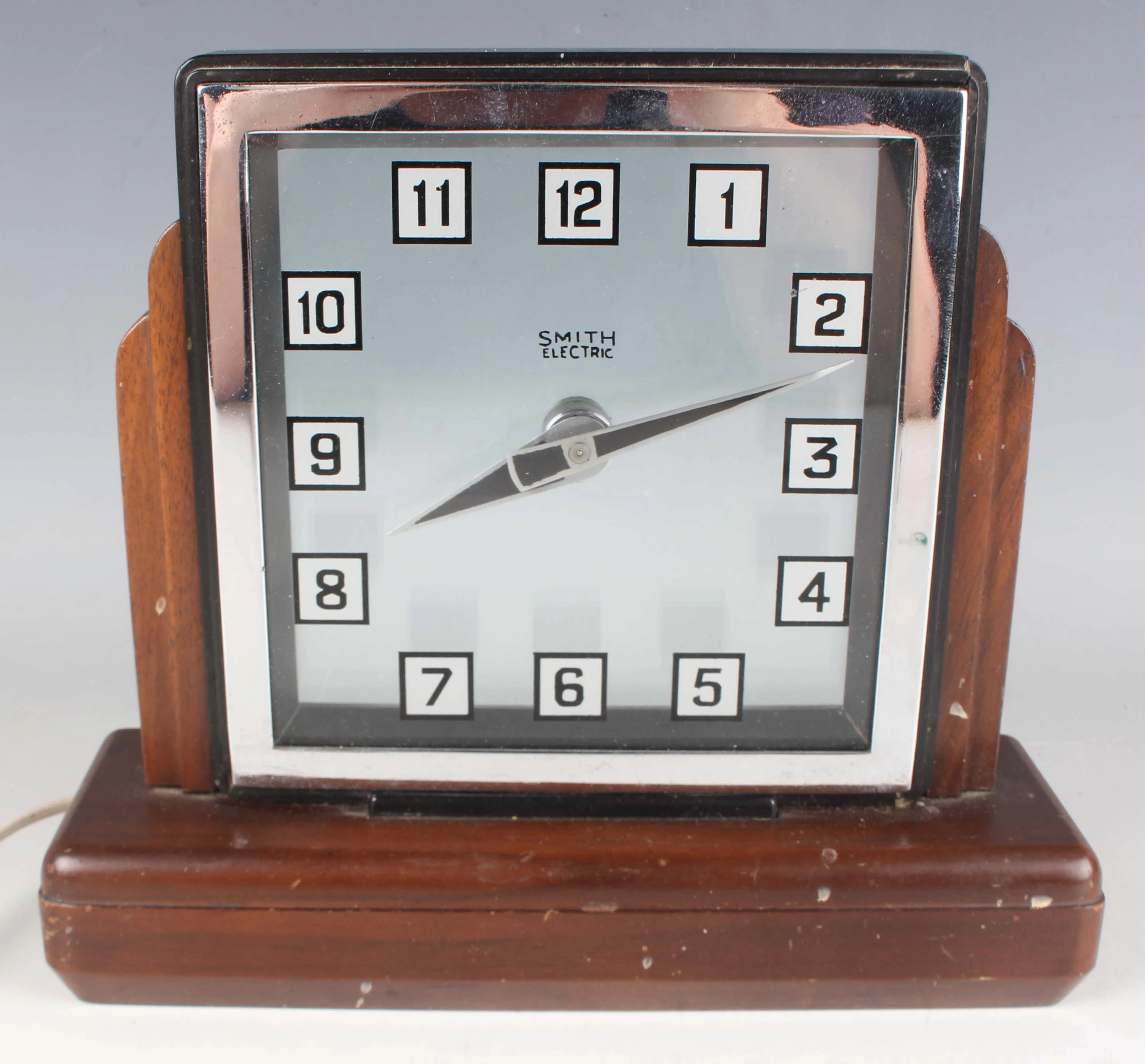 An Art Deco Smiths Electric Mystery mantel clock, the square glass