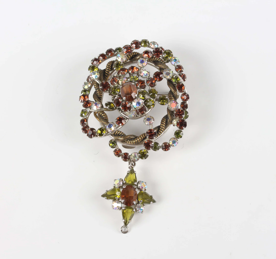 A Christian Dior varicoloured rhinestone brooch, circa 1959, of spiralling