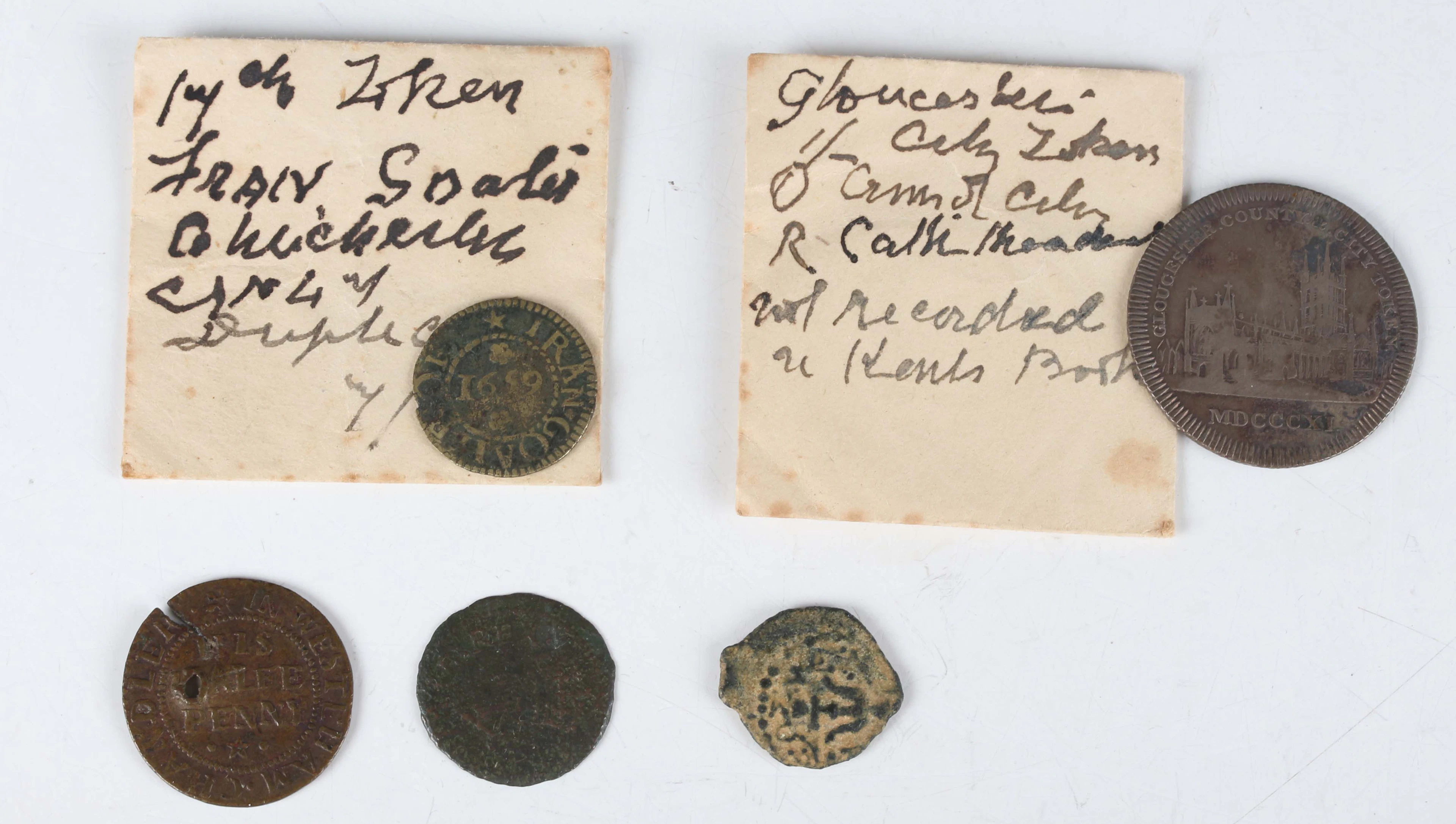 A small group of various tokens and paranumismatic items, including