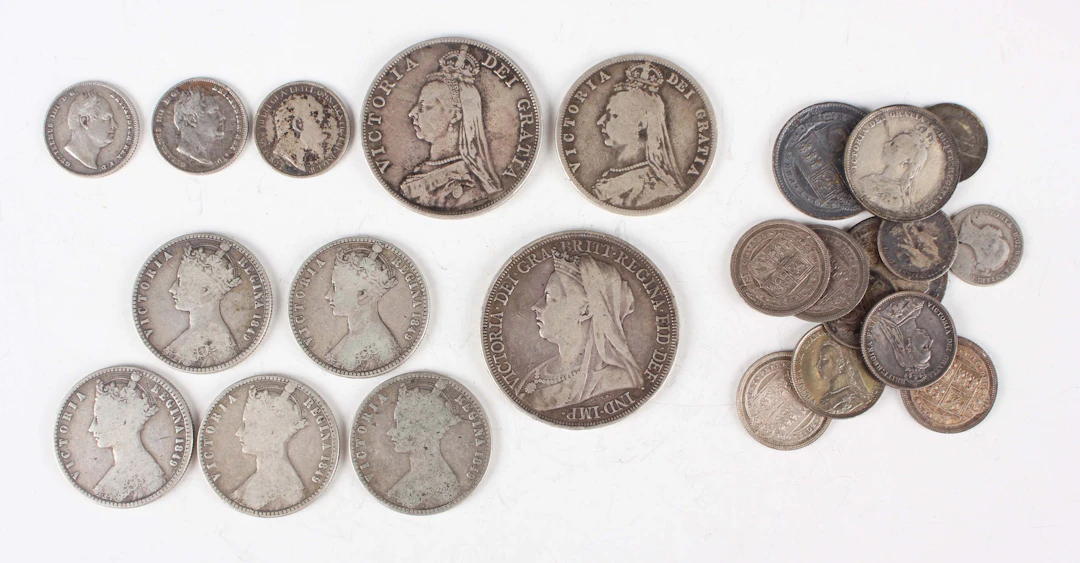 A collection of silver coinage, including a Victoria Veiled Head crown