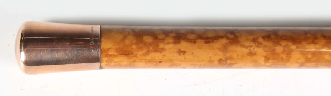 A George V Malacca walking cane with a 9ct gold pommel, London 1916