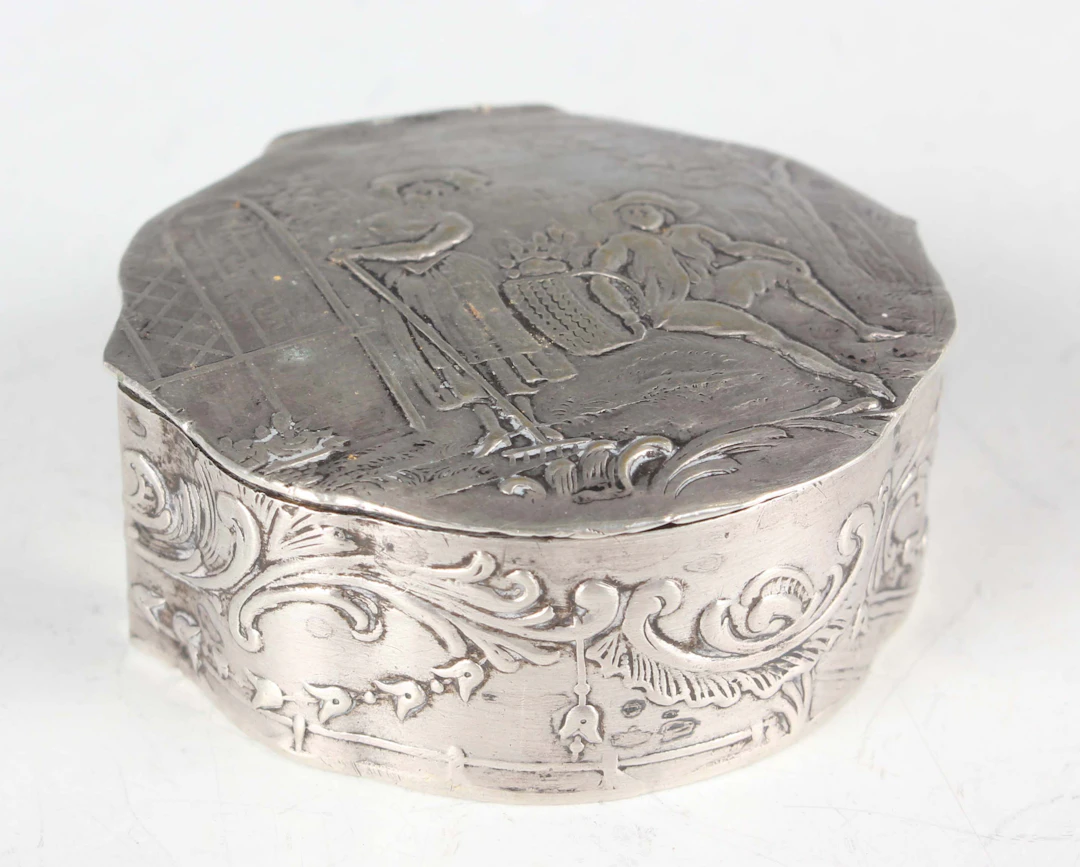 A late 19th century French silver circular pillbox, the hinged lid