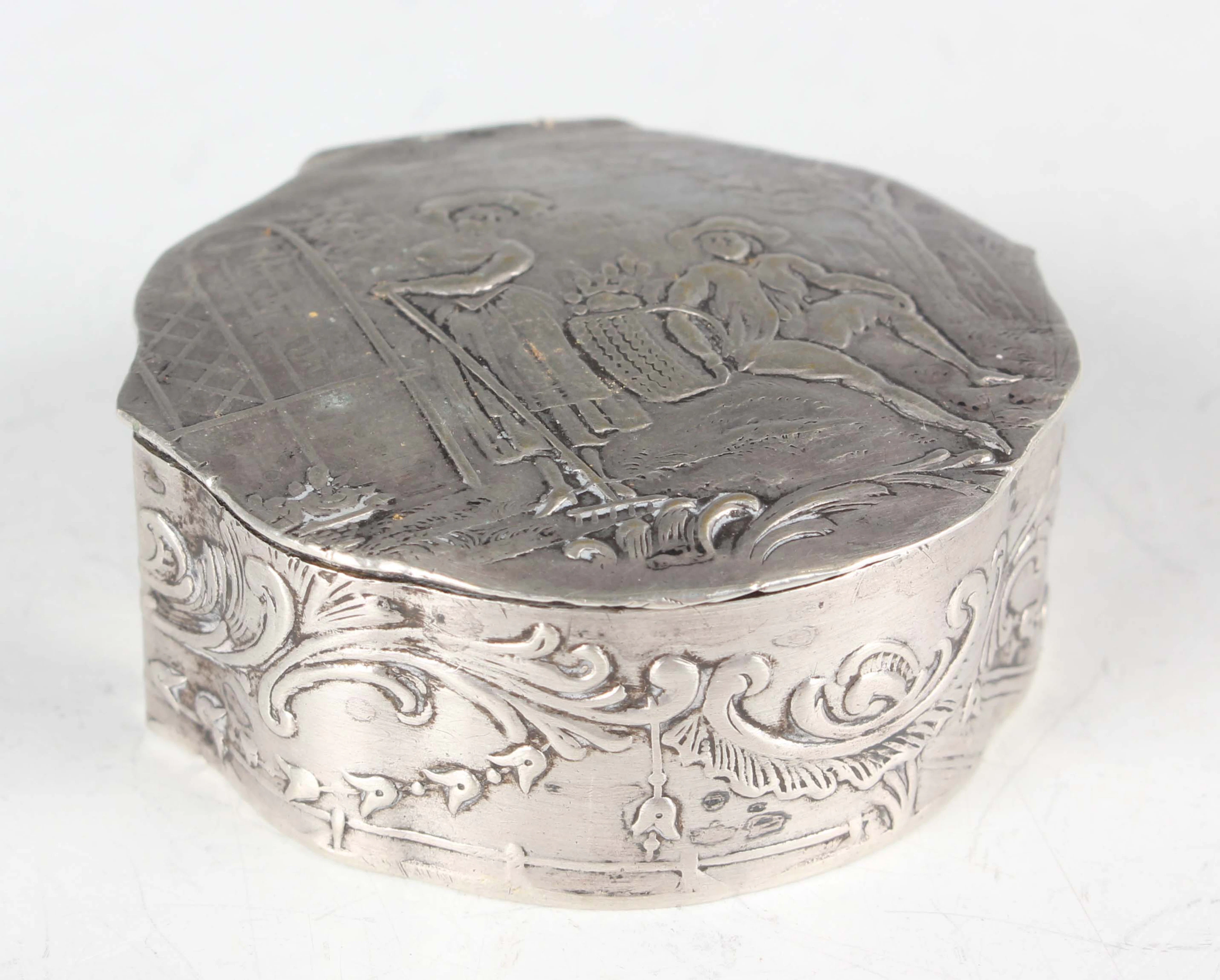 A late 19th century French silver circular pillbox, the hinged lid