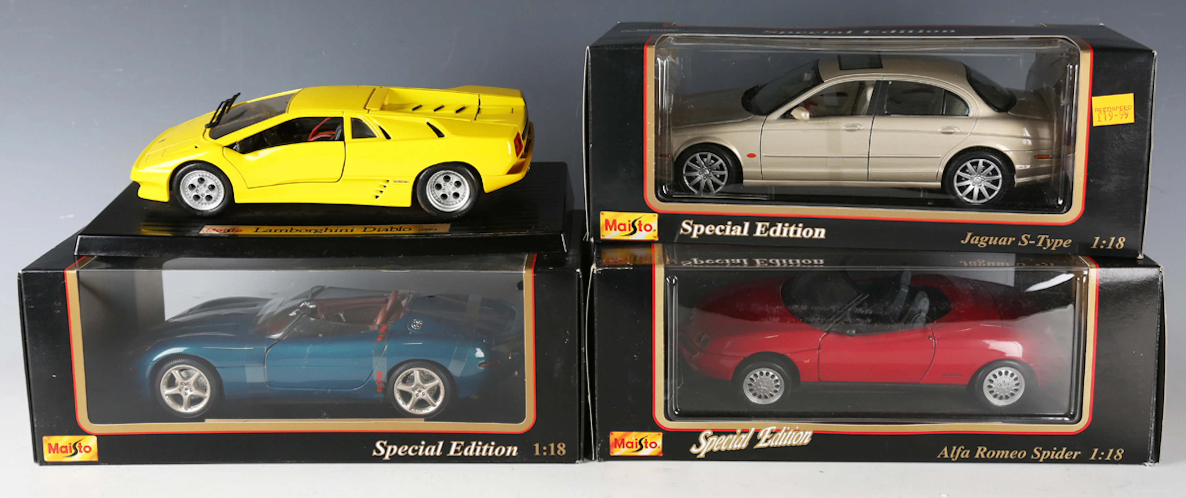 A collection of Maisto model vehicles, including 1:18 scale Jaguar