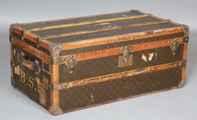 An early/mid-20th century Louis Vuitton travelling trunk with overall